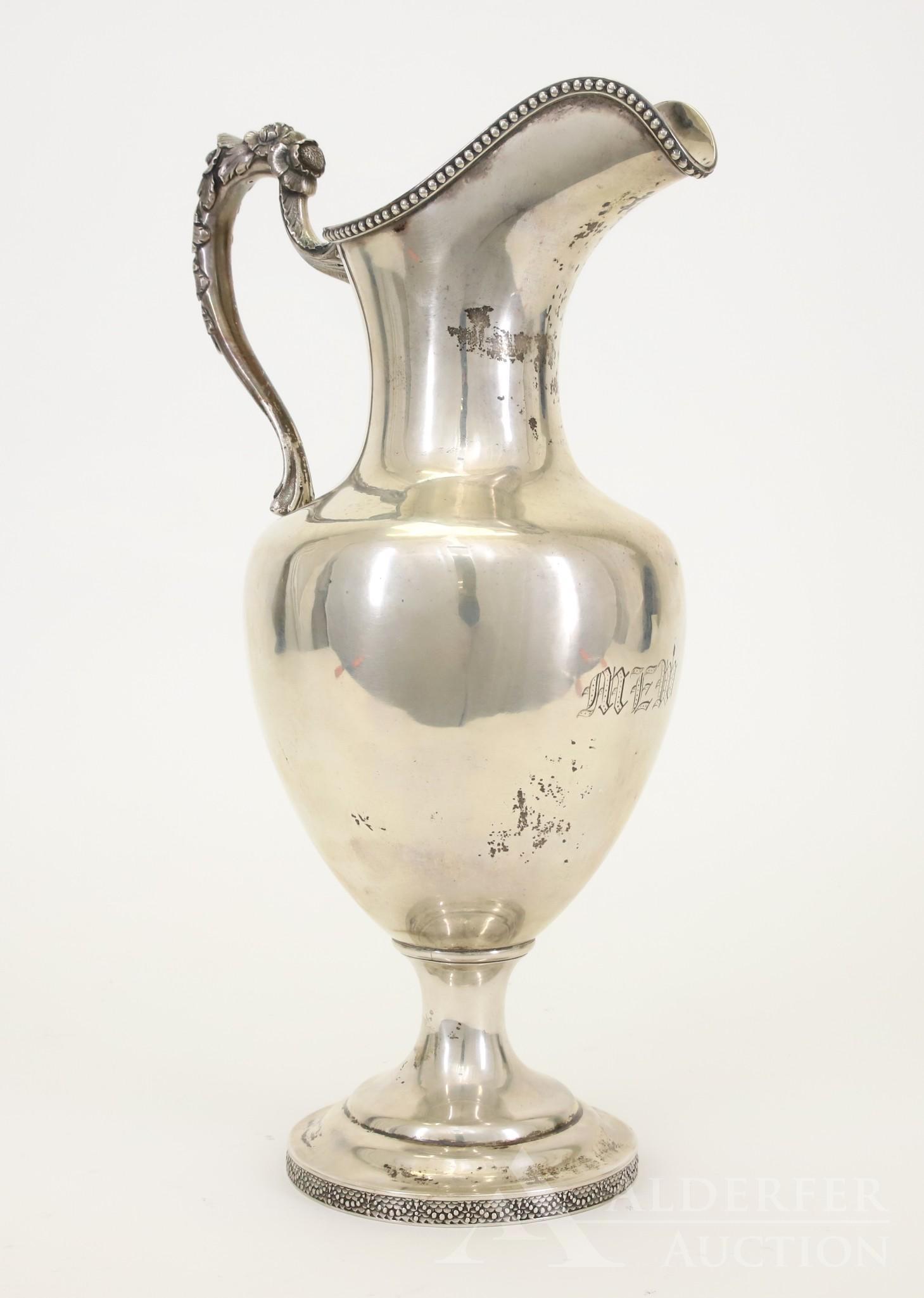 George Sharp for Bailey & Co. Coin Silver Presentation: Philadelphia, Pennsylvania, circa 1852-1856 Marks: BAILEY & CO, CHESTNUT ST PHILA, (lion passant), (lion-S-shield) The pitcher in baluster form having beaded rim, textured foliate handle, applied bead