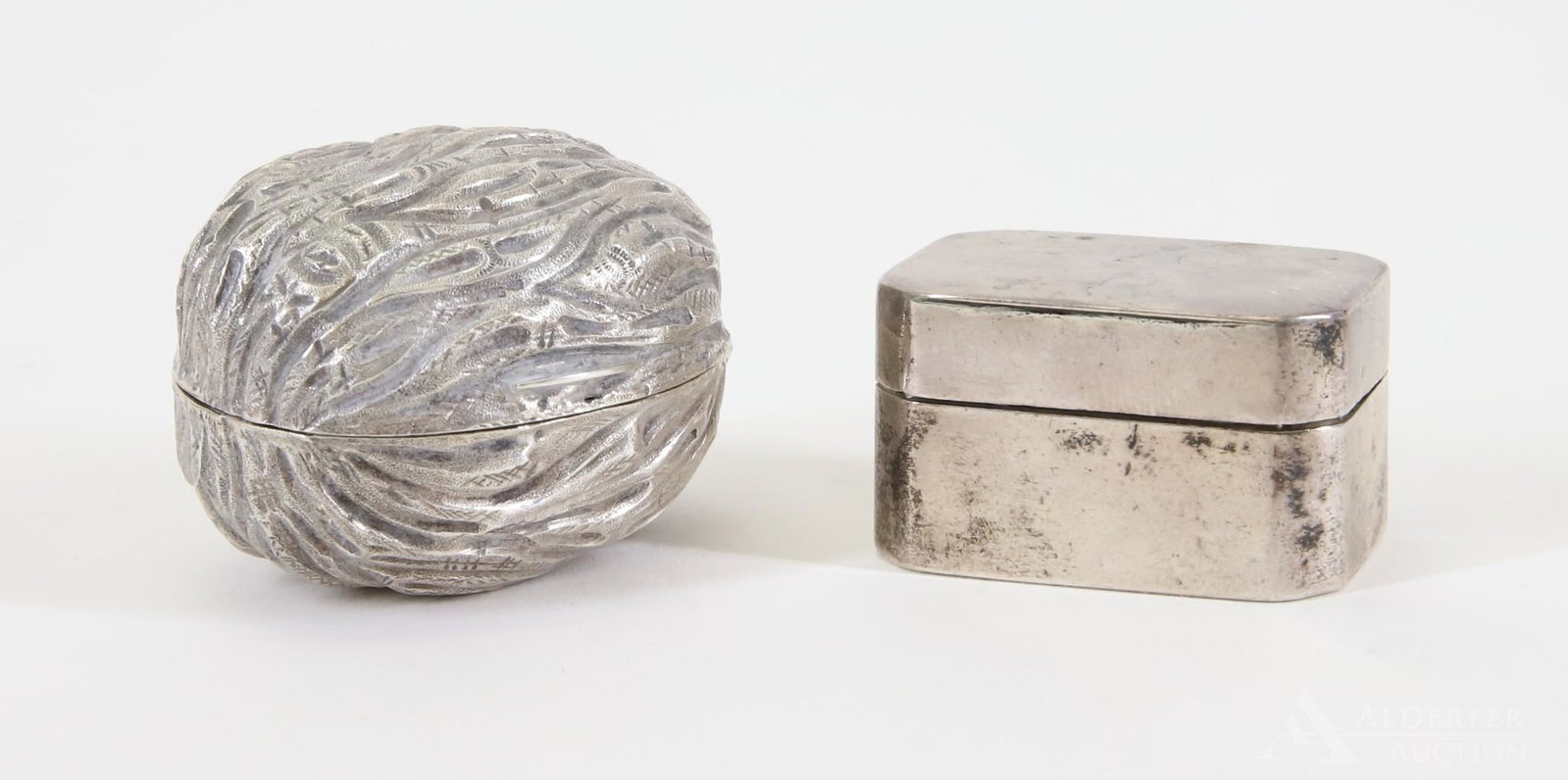 Georgian and Victorian Sterling Silver Nutmeg Grinders: Includes a walnut form grinder by Hilliard and Thomason, Birmingham, 1875 and a rectangular form with rounded corners by Thomas Willmore, Birmingham, 1799