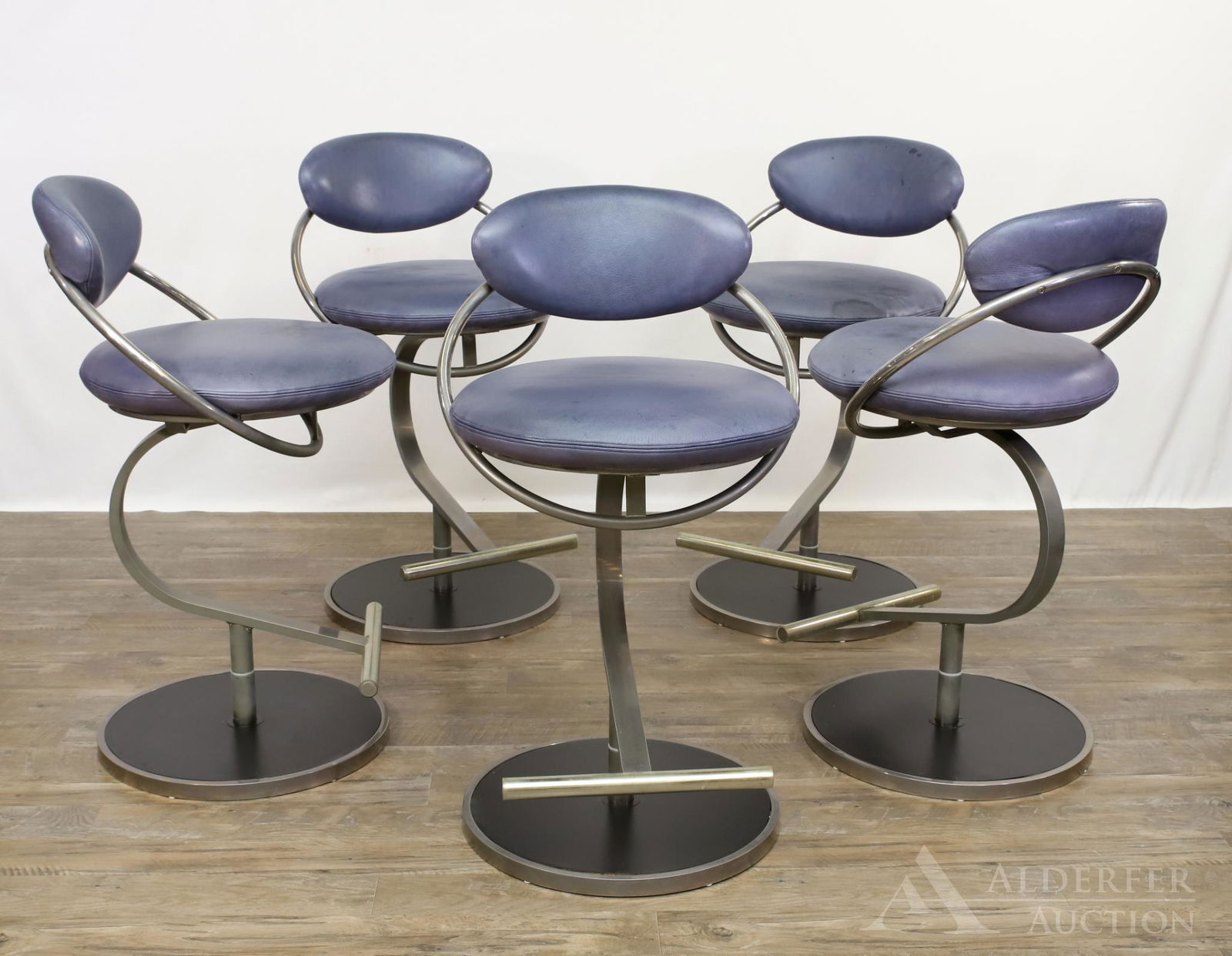 Design Institute of America Modernist Bar Stools: Set of (5) bluish gray leather stools with circular and curved chromed steel frames. 35h" x 18" round