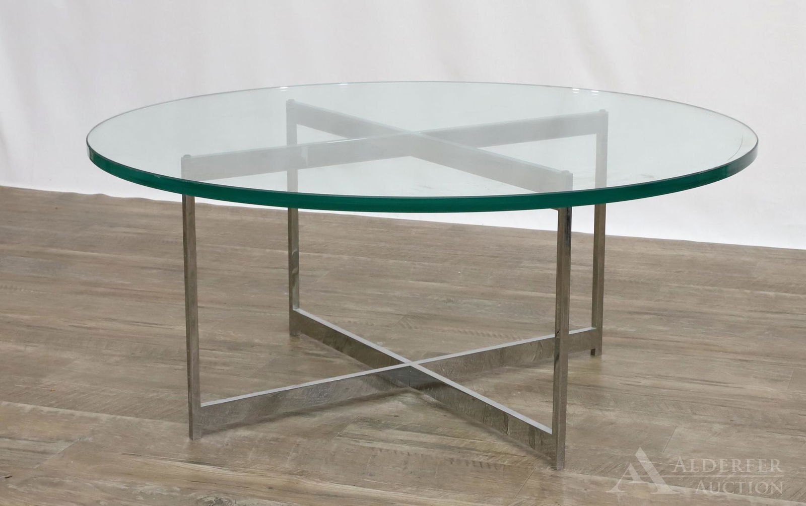 John Stuart for John Widdicomb Coffee Table: Circular glass top with a chrome steel base. 15h" x 36" round