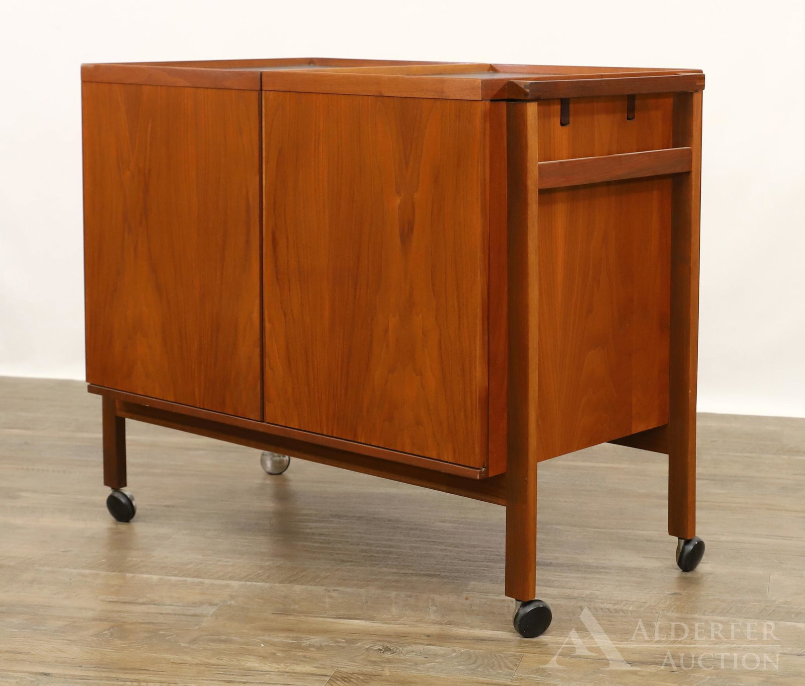 Sibast Danish Walnut Bar Trolly: Double slide out bar extending to an interior compartment with bottle racks and glass holders. 29h" x 34.5w" x 19.75d"