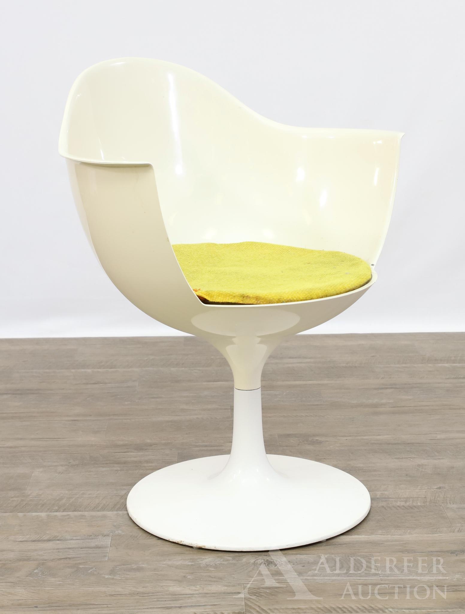 Eero Saarinen Mid-Century Modern Tulip Chair: Molded fiberglass arm chair with original cushion insert, cone shaped pedestal on a circular base. 31.5h" x 26w" x 20d"