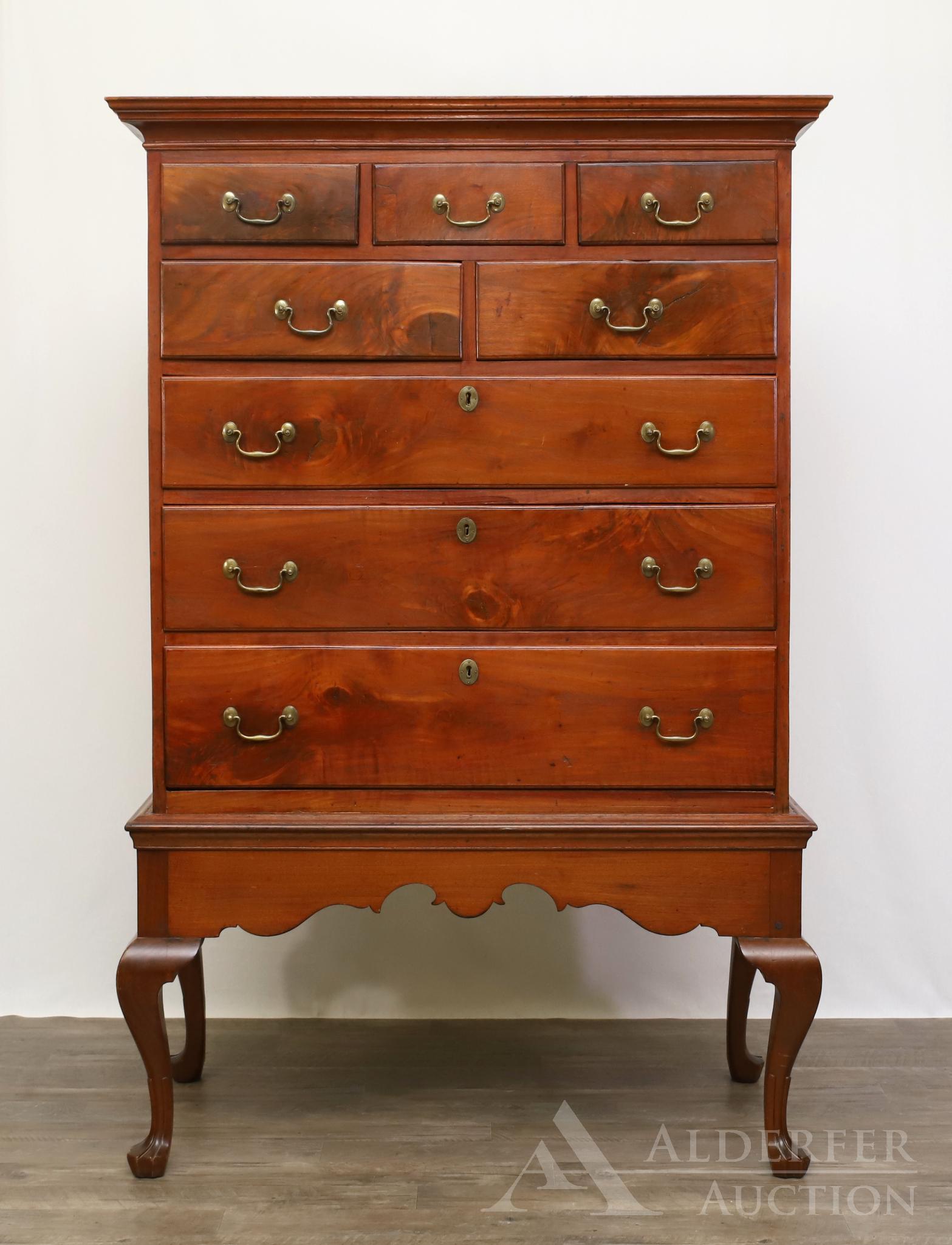 Pennsylvania Chippendale Walnut Chest-on-Frame: Molded cornice with three over two over three pine secondary drawers resting on a scrolled apron frame with trifid feet. Lip loss and repairs. 65.25h" x 43.25w" x 21.25d"