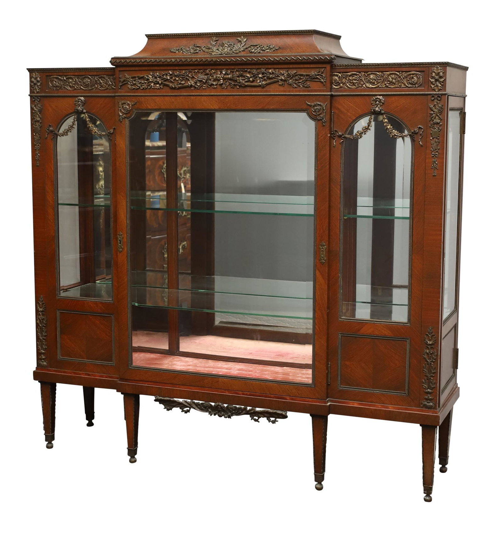 French Kingwood and Ormolu Mounted Display Cabinet: Figural, fruit and vine, and festoon ormolu mounted motifs. Breakfront cabinet with glass shelves with one front door and locking right side door on tapered legs with caps. 54h" x 53.5w" x 14.25d"