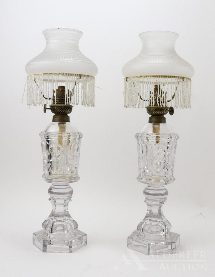 P & M Manufacturing Co. Oil Lamp: Pair of P&A Manufacturing Co, "The Victor", whale oil lamps. Maker's mark on wick adjustment knob, no patent date. 6-sided glass body with impressed thumb and star design. Frosted glass globe with etc