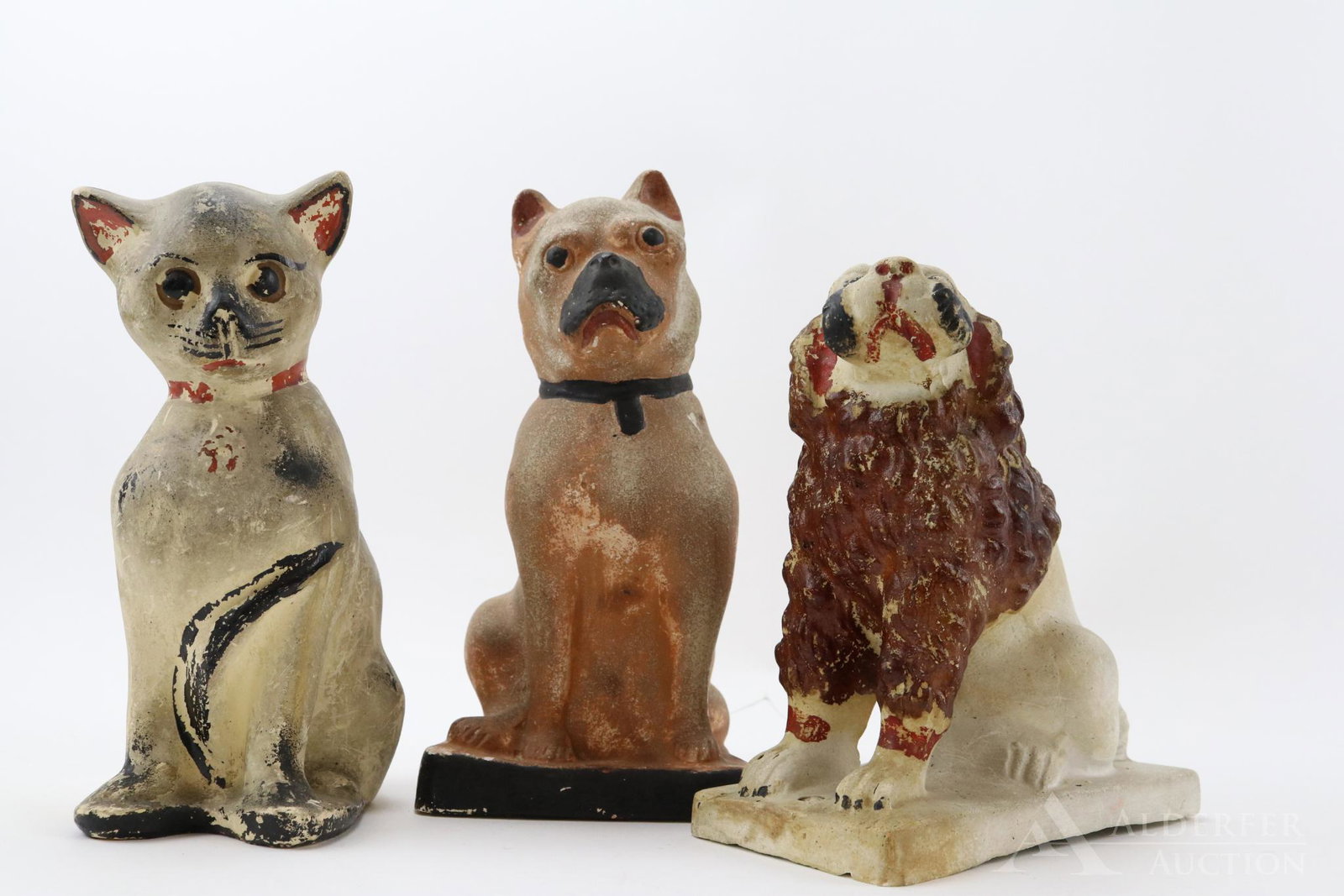 Chalkware: Painted chalkware grouping includes cat, bulldog and dog with curly mane. Tallest 9.75"