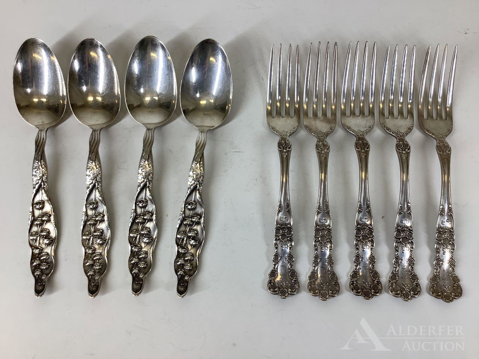 Lily of the Valley and Buttercup Sterling Silver: Grouping includes (5) Gorham "Buttercup" salad forks and (4) Whiting "Lily of the Valley" table spoons. 12.2ozt