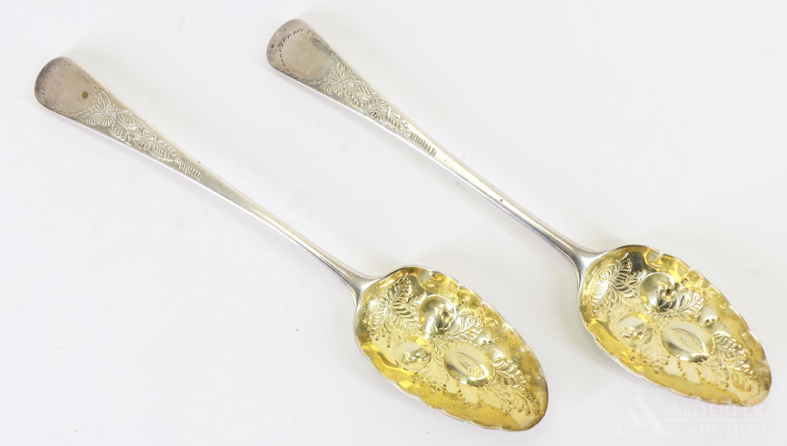 George III Sterling Silver Berry Spoons: Pair of Georgian sterling silver berry spoons with gold washed bowls. The first is London dated 1796 by Geo. Smith III and Wm Fearn. The second 1791 unknown maker. 3.8ozt