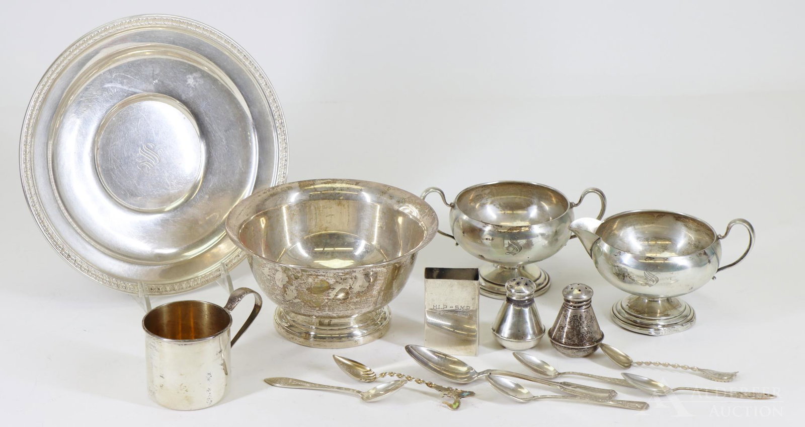 Sterling Silver Tablewares: Includes a tray, presentation bowl, open creamer and sugar, baby cup, matchbook cover, a variety of spoons and a pair shakers. Tray is 8"round and 22.4ozt