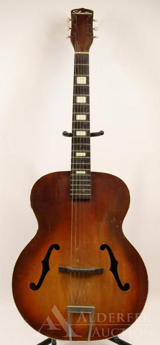 Silvertone Hollowbody Acoustic Guitar: Silvertone Archtop Acoustic Guitar Stamps on interior of guitar are 4175H1213 and PMV Muted sunburst finish. Some loss to finish and separation on bottom seam. Crack on top emanating from "F"hole towa