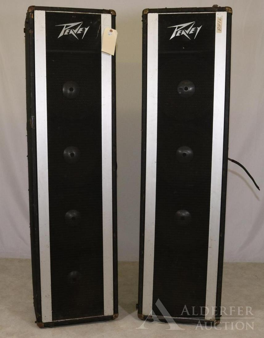 Peavey Loudspeaker Pair: 2 Peavey Loudspeakers 4x12" and one horn each. Loss and wear to cabinets Playing condition unknown. One cone and one tear in two speakers Cabinets measure 60.5"h x 16"w x 11"d