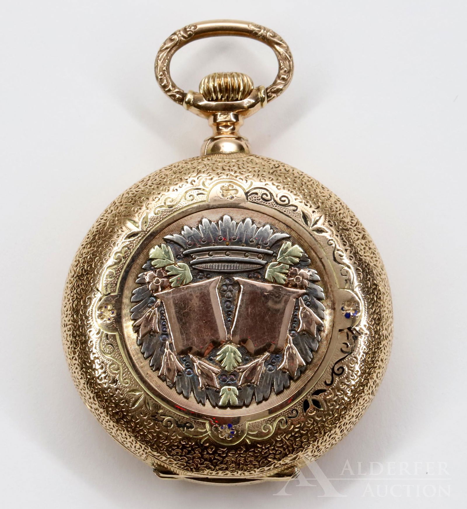 14K Gold Pocket Watch: Yellow gold hunter case with tri-colour gold decor in high relief. White single sunk dial has black Roman numerals and blue hands. Cuvette: ANCRE LIGNE DROITE Spiral Nickel Breguet 19 rubies Remontoir