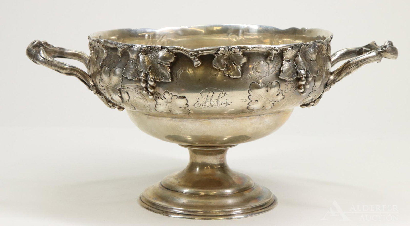 19th c. Tiffany, Young and Ellis Silver Bowl: American silver bowl with chased grapevines and naturalistic vine rim by Tiffany, Young and Ellis, New York. Circa 1848-1852, JC Moore maker. 5.25"h x 11.5"w 24.3ozt