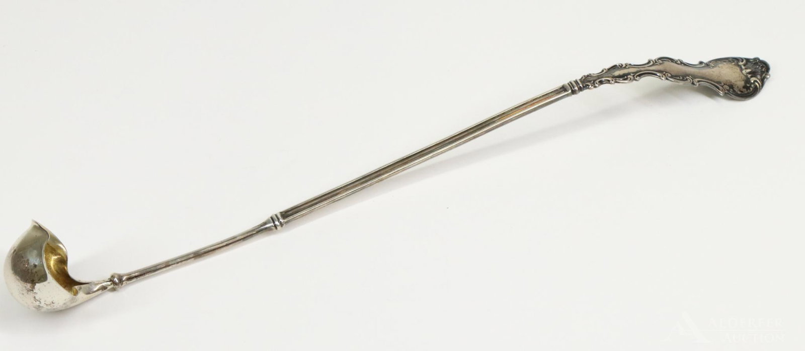 Gorham Sterling Silver Ladle: Gorham sterling silver long handled ladle or scoop in the Cromwell pattern. Gold washed bowl. 14" l and 2.8 ozt