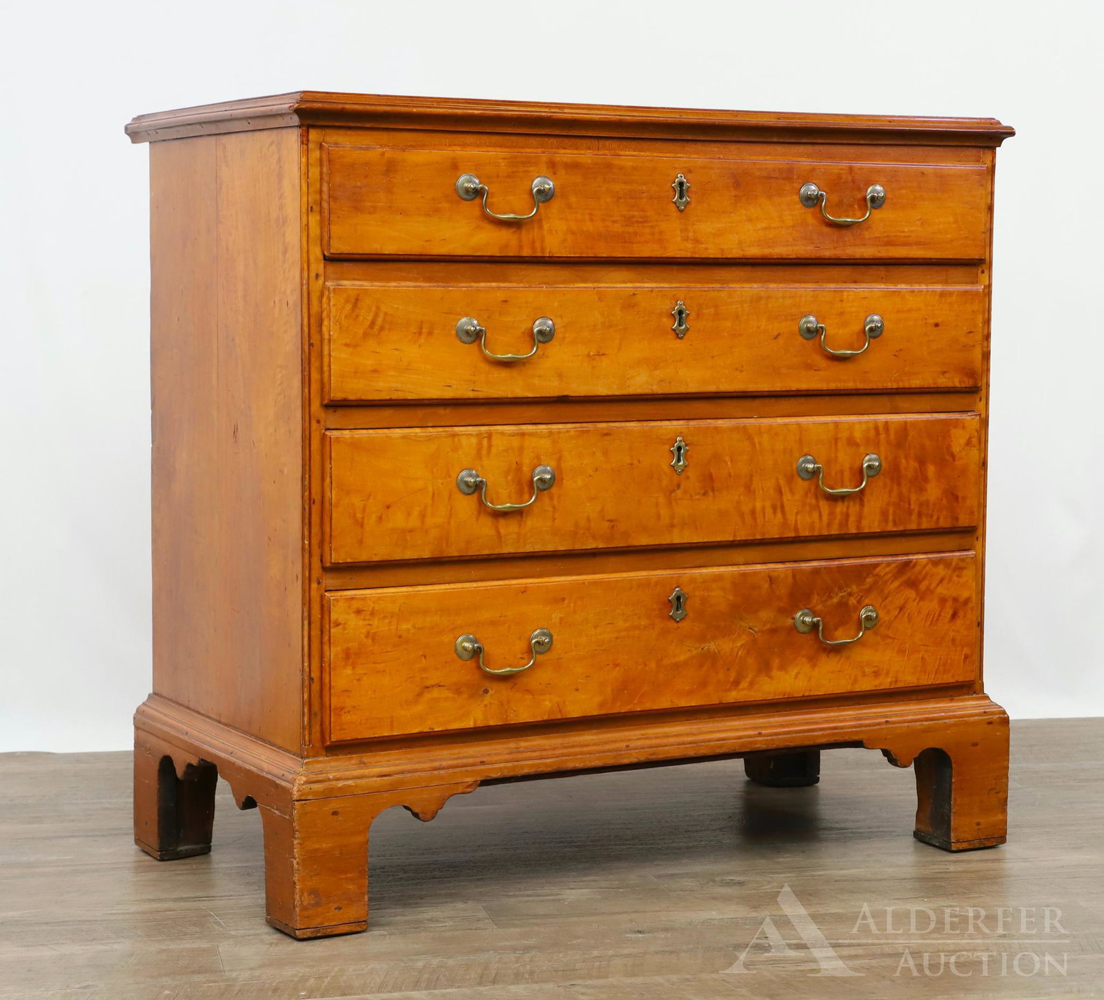 Chippendale Chest of Drawers: Figured maple case with four graduated drawers on shaped bracket feet. Hand written label on back with dates from the late 18th c. and early 19th c.33.5"h x 35"w x 20"d