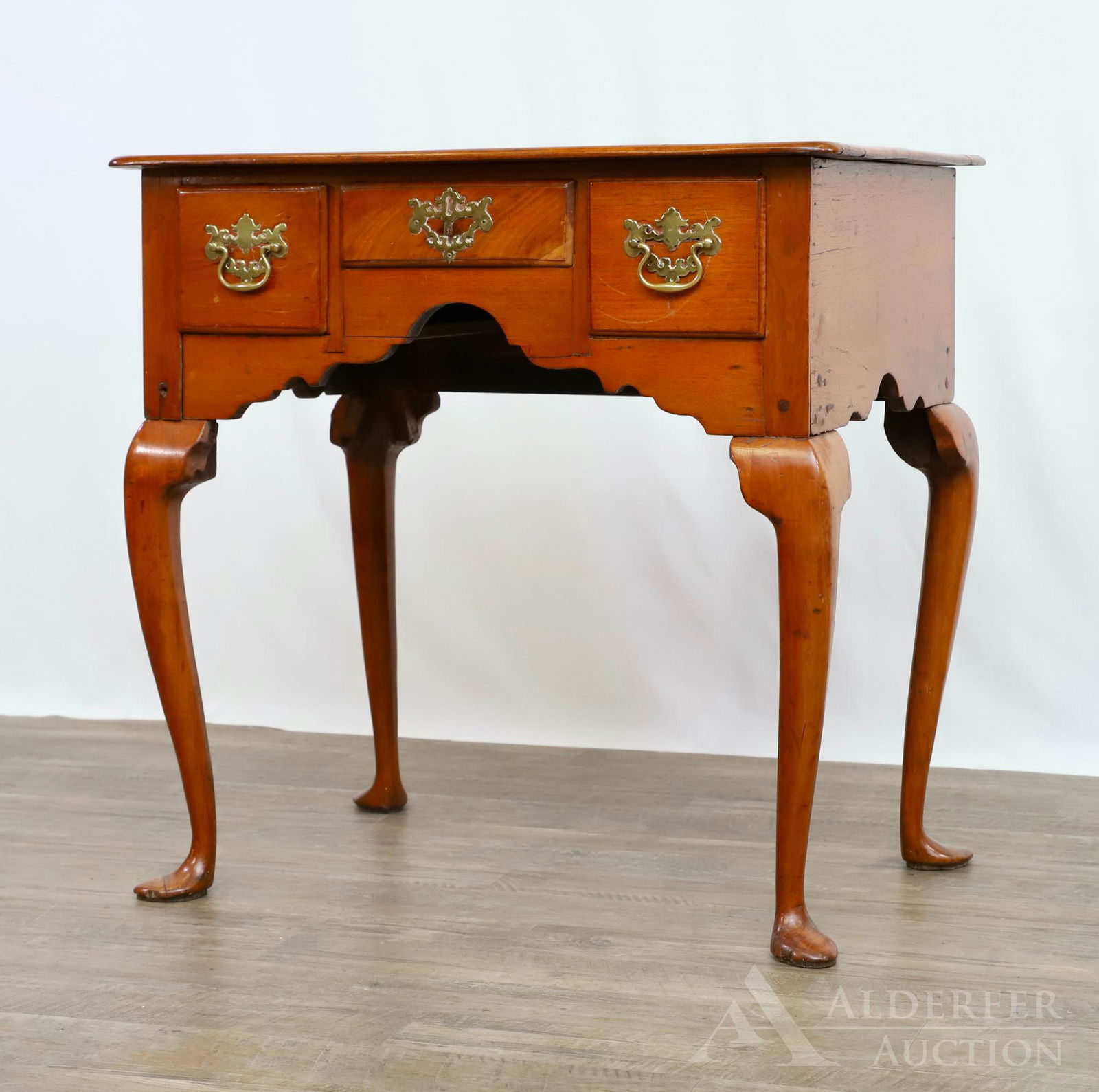 Queen Anne Lowboy: Walnut lowboy, three drawers, shaped skirt, cabriole legs terminating in spade feet. 29.5"h x 30"w x 20"d