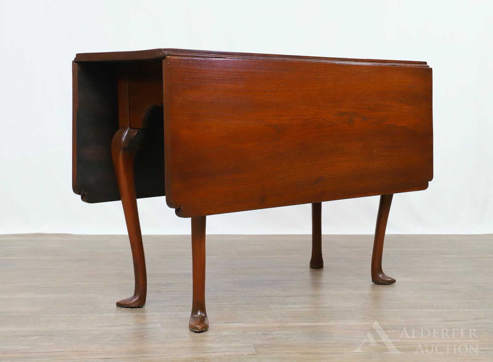 Queen Anne Walnut Drop Leaf Table: Top with cut corners, shaped skirt, cabriole legs ending in spade feet. 28"h x 15.25"w (46"w open) x 43.25"d