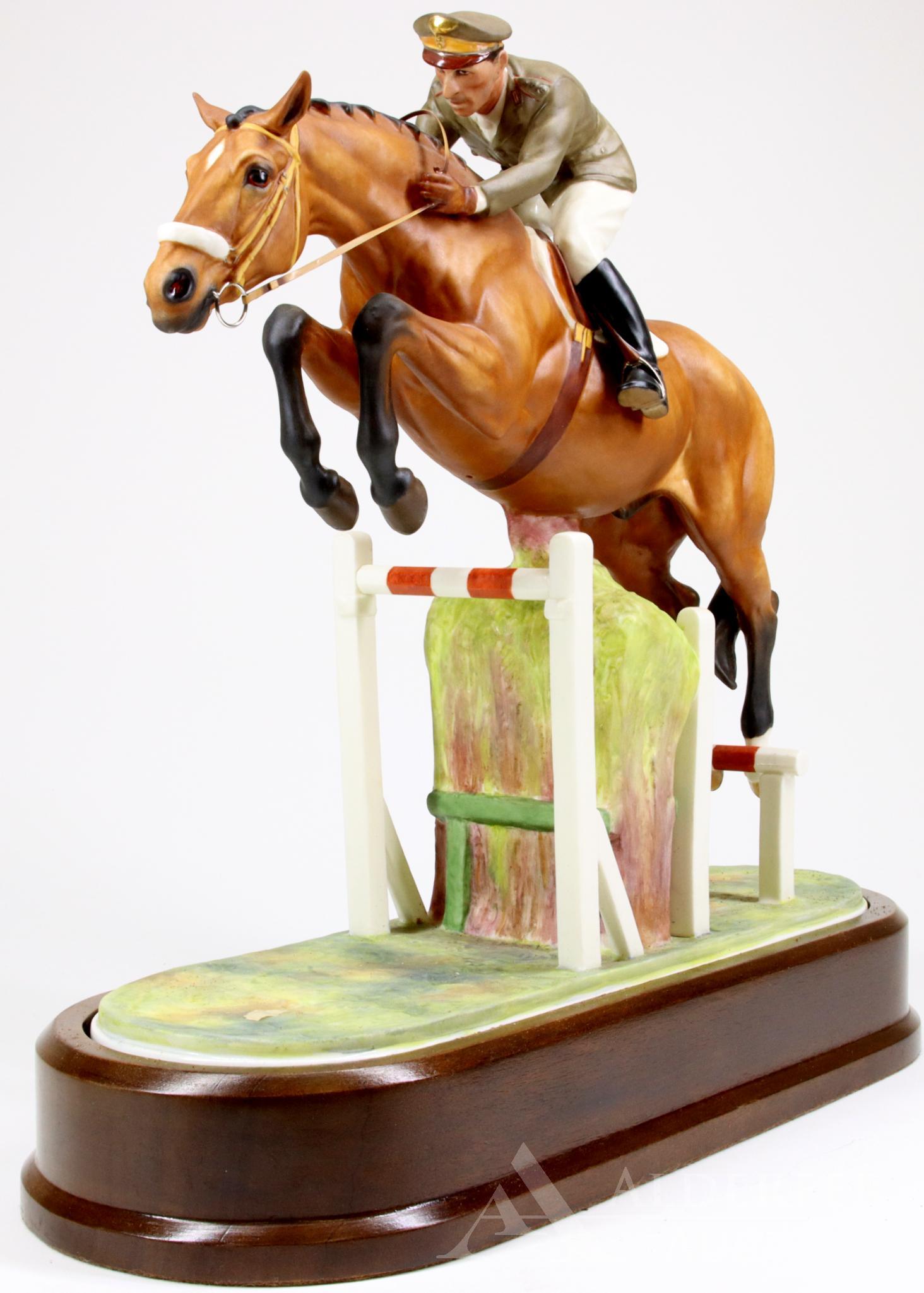 Royal Worcester "Merano and Captain Raimondo d'Inzeo": Royal Worcester figure of a jockey jumping over a fence, modeled by Doris Linder, c 1963. Hand painted and marked on the bottom. 11.5"h x 12"w