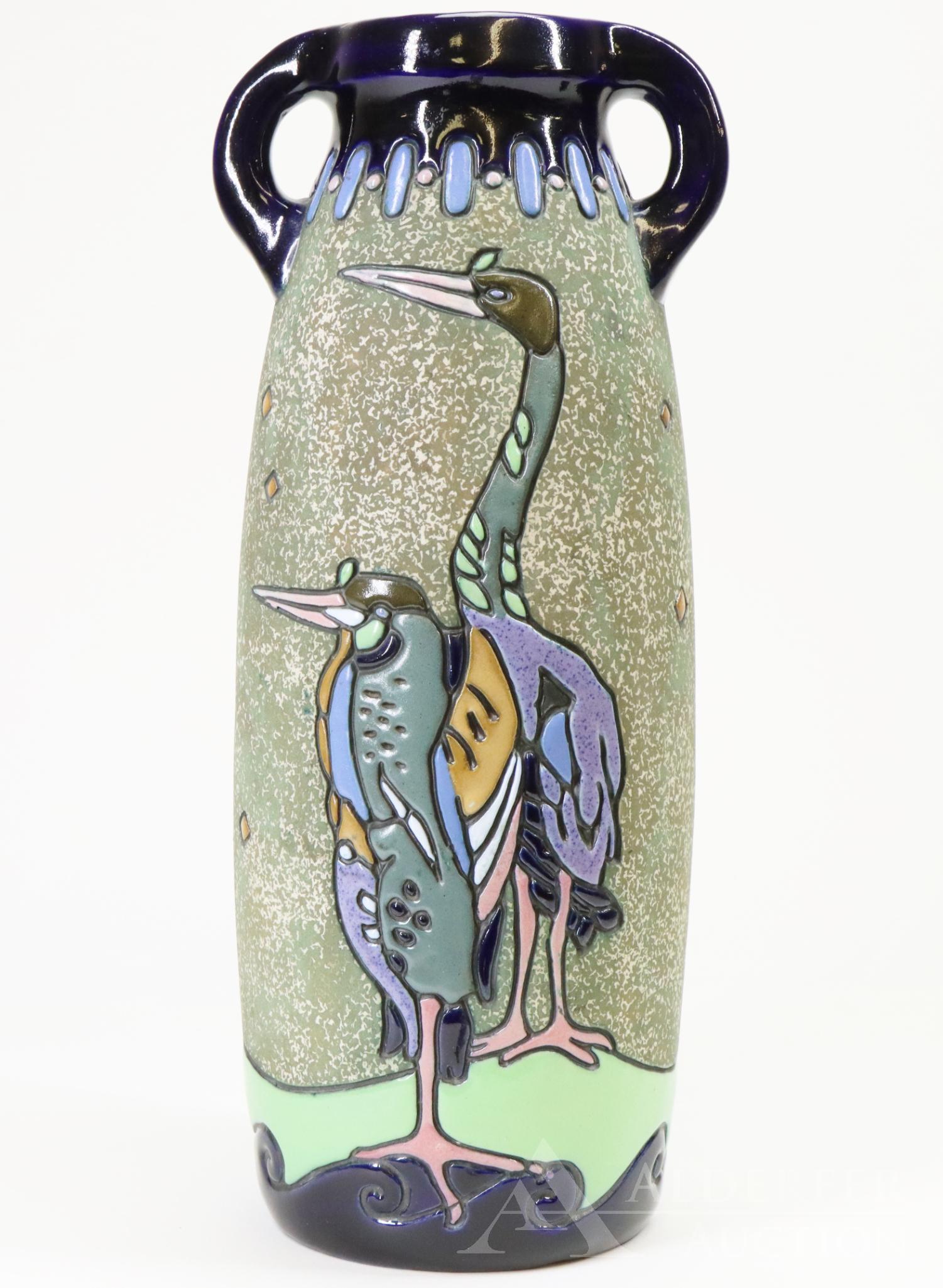Amphora Pottery Vase: Amphora Pottery (Czechoslovakia) handled vase with raised enameled standing birds, 14"h x 6"w.