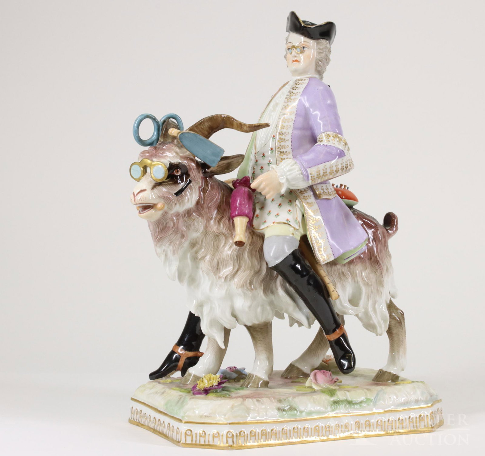 Dresden Porcelain Statue of Count Bruhl's Tailor: Dresden Porcelain statue of Count Bruhl's Tailor riding a goat decorated with tailors tools. Blue Dresden mark to the base. 12"h x 9.5"w x 5"d