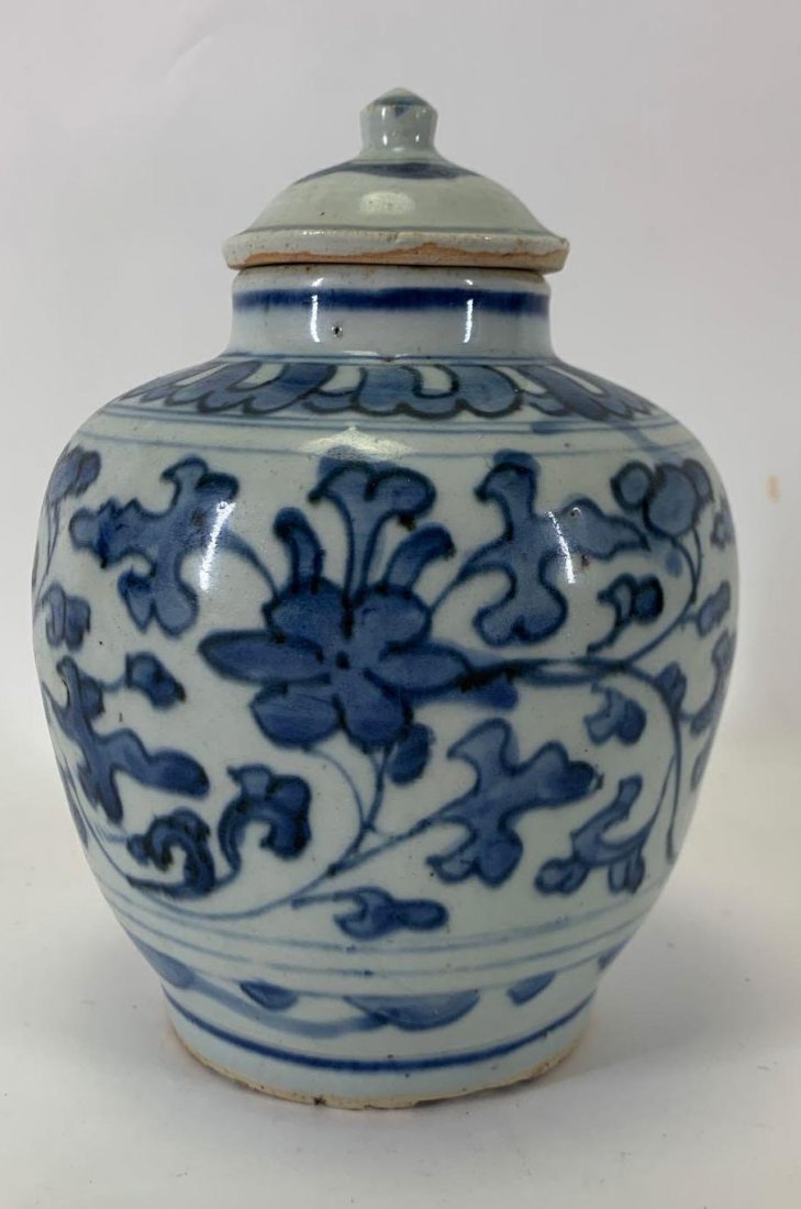 Ming Dynasty Covered Jar: Decorated with blue and white floral sprays. Signed base. 7.5"h x 5" round
