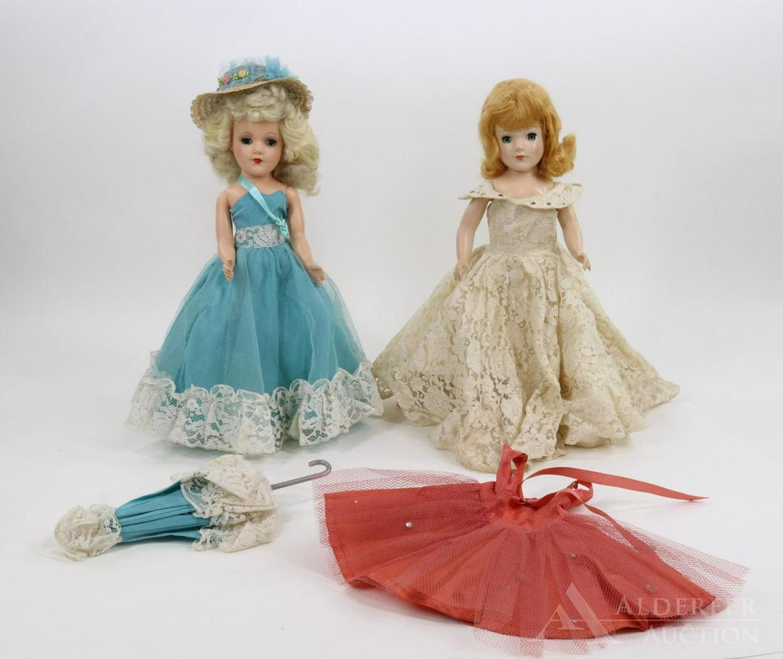 DOLLS OF THE 1950's-60's.: Pair of dolls in tagged clothing. Both dolls have blue eyes. Marked MARY HOYER: Platinum blonde - in aqua gown/matching parasol. Gold mules. Unmarked doll with circle only on back. Honey blonde - lace