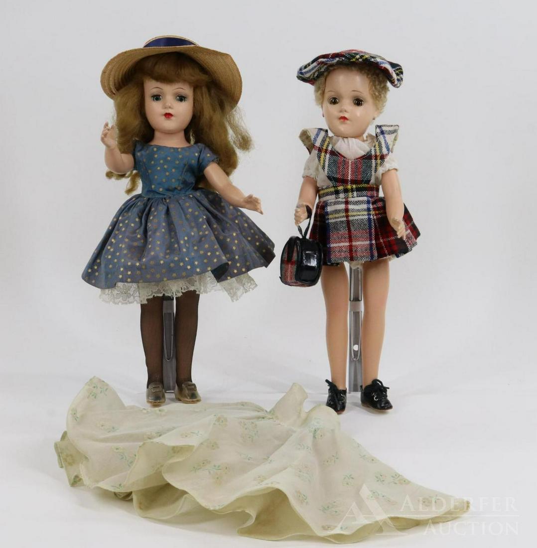 DOLLS OF THE 1950's-60's.: Pair of marked MARY HOYER dolls. Doll 1) has honey blonde hair and blue eyes. She is wearing a tagged taffeta dress with gold stars. Condition: hair has been combed/played with. Dol 2) l with caracul 