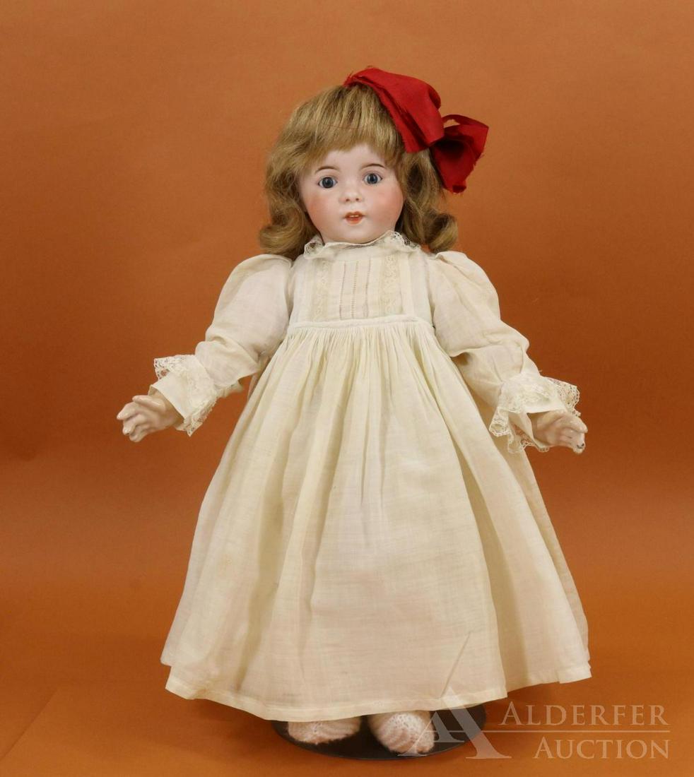 FRENCH BISQUE HEAD DOLL.: 16 1/2" S.F.B.J. 247 PARIS 6 Character Toddler doll. Blue sleep eyes, open/closed mouth showing (2) teeth, curly brown mohair wig. Very clean fully jointed French papier mache toddler body marked (rou