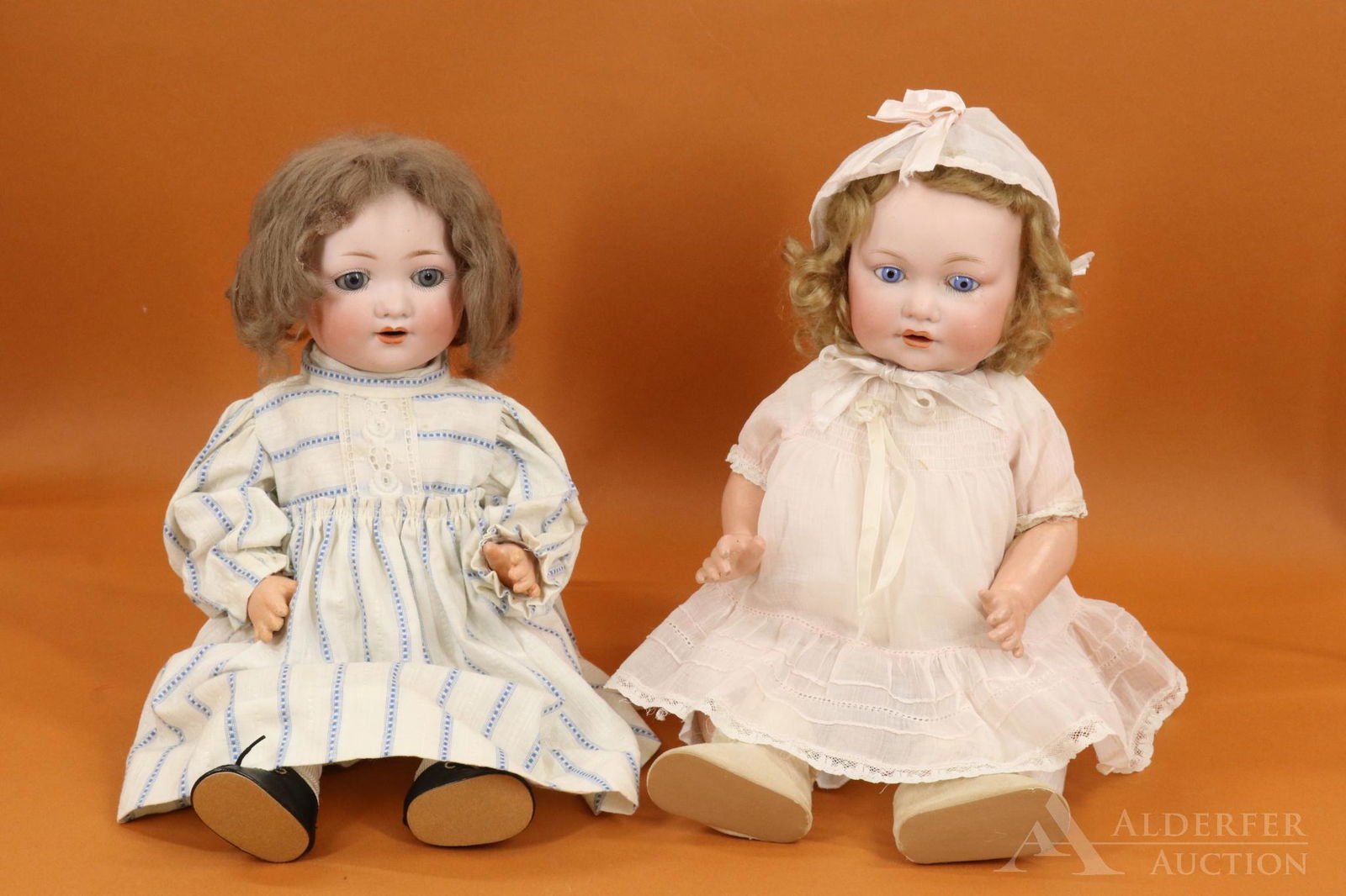 GERMAN BISQUE HEAD BABY DOLL(S).: Pair of Armand Marseille character dolls. Both dolls have blue eyes, open mouths, mohair wigs, 5 pc. papier mache bent limb baby bodies. 15 1/2" 985 GERMANY A.5.M. with sleep eyes, dimples, brown wig.