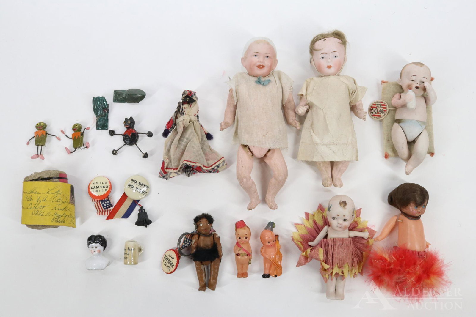 LOT OF HOLIDAY/NOVELTY.: Lot of dolls - Bisque: 7" RXX-12/0 RXA (rub on nose). 8" (raised P) 28 - 12/0 with molded cap. (fine hairline cracks). Both of these dolls need to be restrung. 5 1/2" All bisque NIPPON baby holding mo