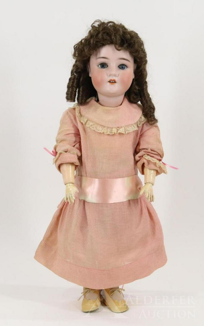 GERMAN BISQUE HEAD DOLL.: 24" "Rose" PANSY IV doll. Brown sleep eyes, open mouth, synthetic wig. Papier mache ball jointed body. Dressed in antique clothing - rose rayon dress, cotton petticoat, pantaloons. Ivory oilcloth shoe