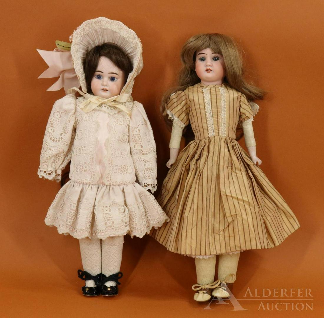 GERMAN BISQUE HEAD DOLL(S).: Pair of ARMAND MARSEILLE shoulder head dolls. Both dolls have blue eyes, open mouths, brown human hair wigs, white leather bodies. 15 1/2" 3200 AM 0 1/2D.E.P. MADE IN GERMANY doll with stationary eyes