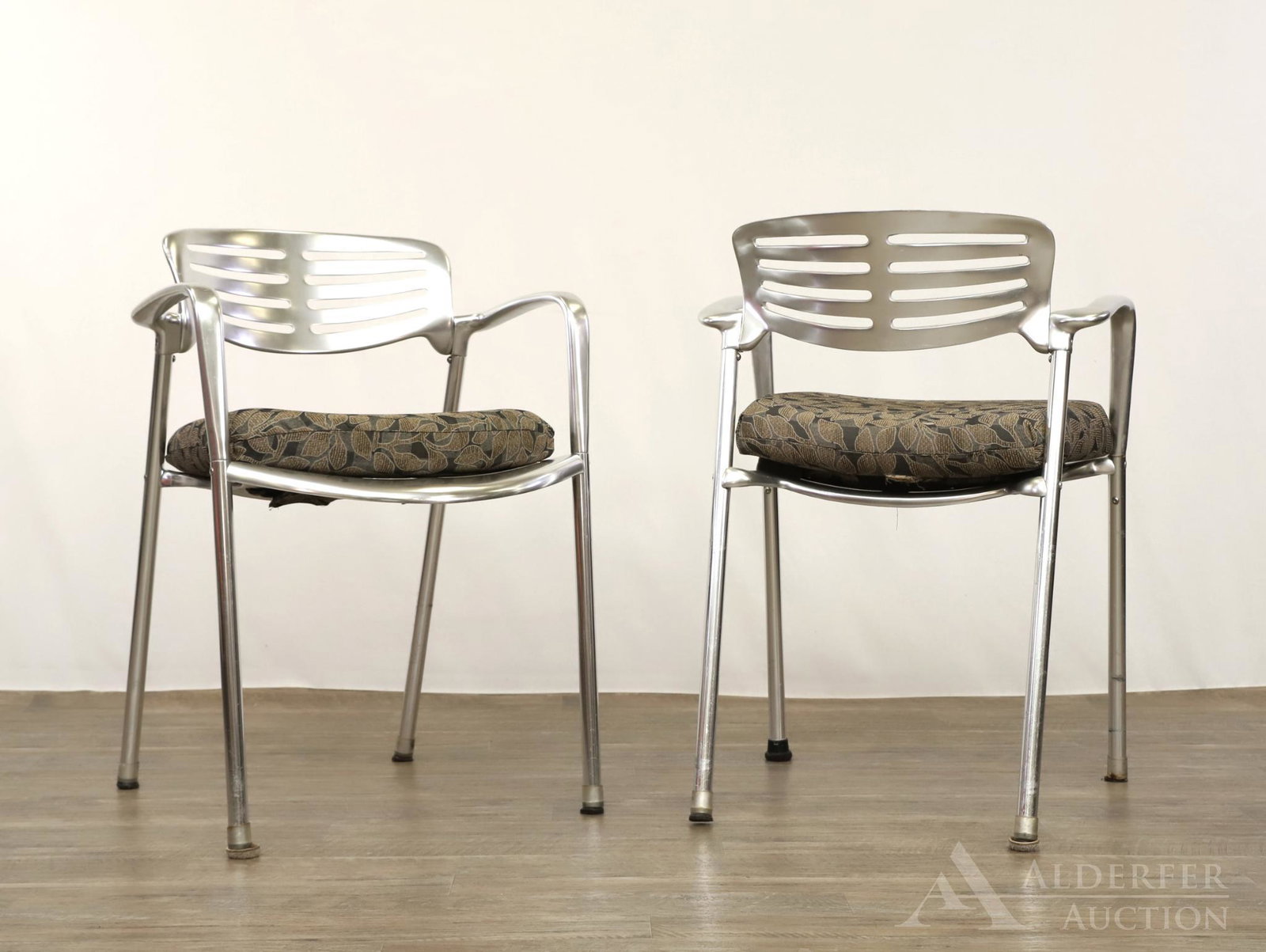 Jorge Pensi for Amat Toledo Arm Chairs: Pair. Cast aluminum with slatted backs, continuous arms and legs. 31"h x 22"w x 17"d