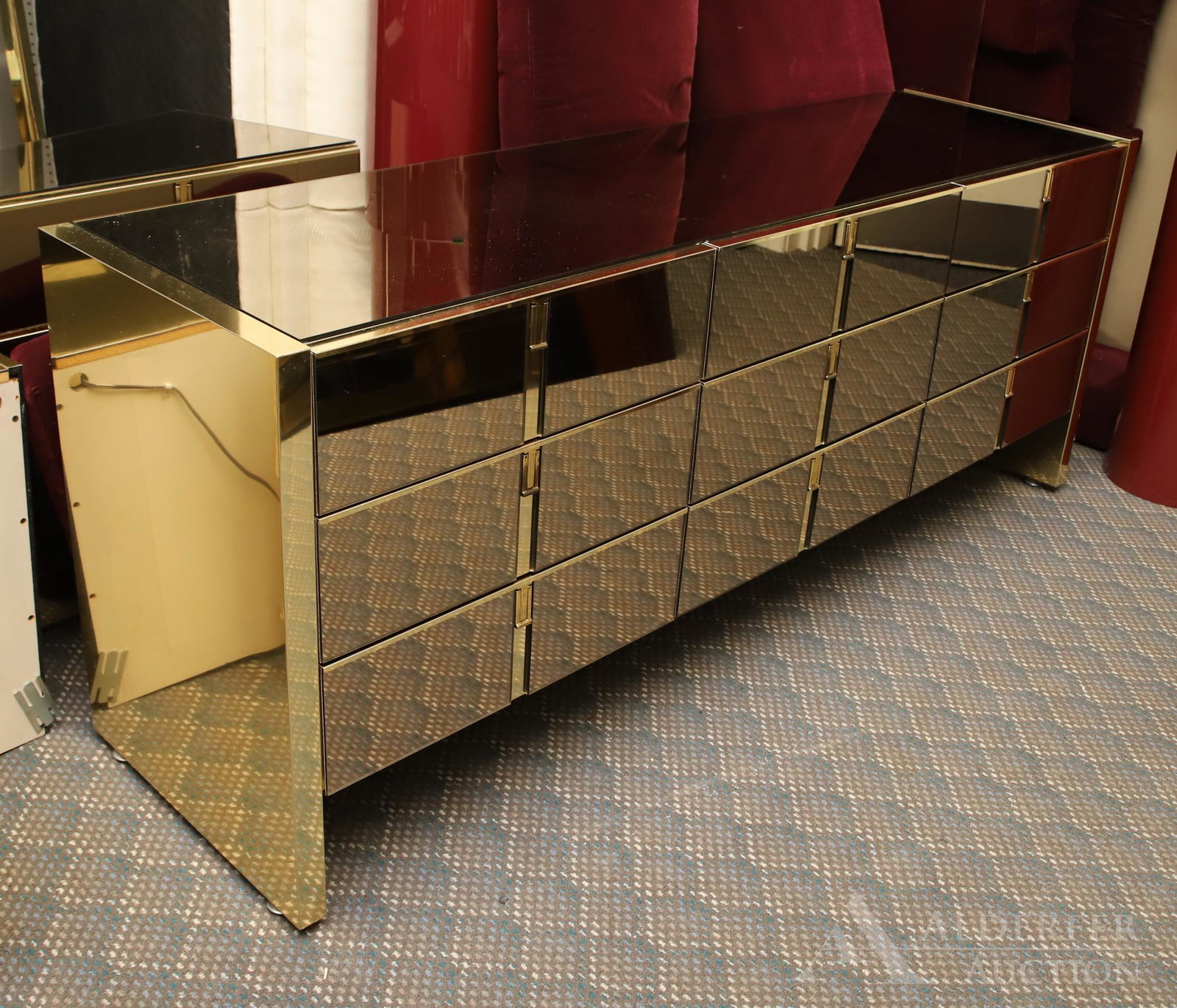 In the Style of Roche Bobois Dresser: Mirrored brass nine drawer dresser. 30"h x 76"w x 21"d