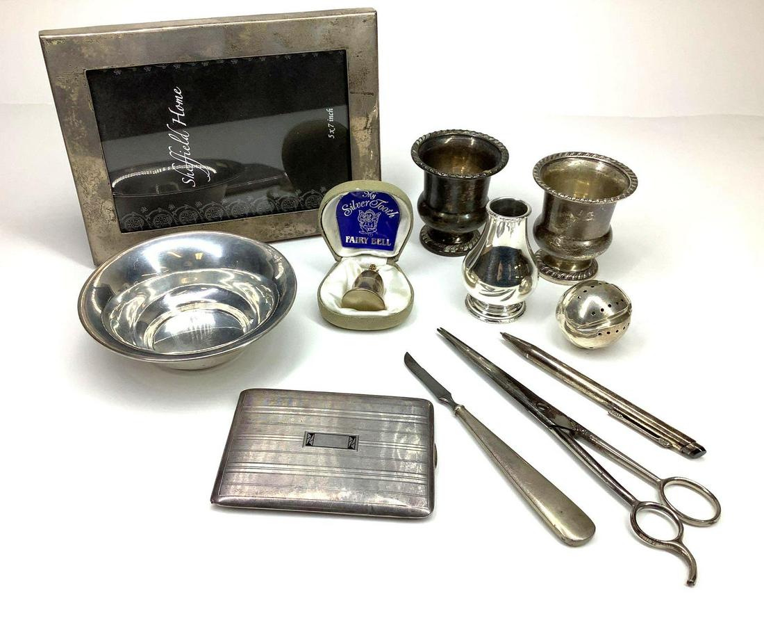 Sterling Silver Assortment: Includes sterling silver 5x7 frame, toothpick holders, cased tooth fairy bell, shaker, tea strainer, nut dish, card case and pen. 13.3ozt not including frame, pen and hollow handled pieces.
