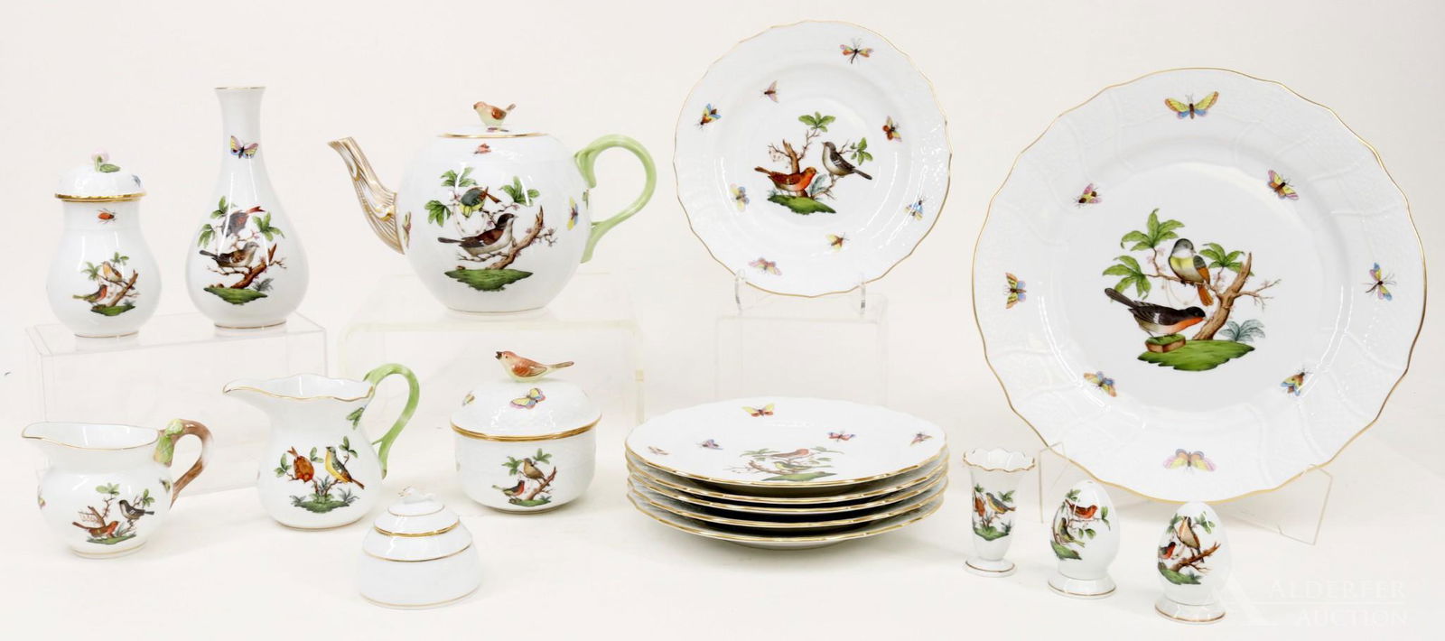 Herend Porcelain Tea Service with Extras: Herend Porcelain in the "Rothschild" pattern including tea pot, covered sugar, pair of creamers, salt and pepper shakers, dessert plates, bud vase, and toothpick holder. Also includes a Herend honey p