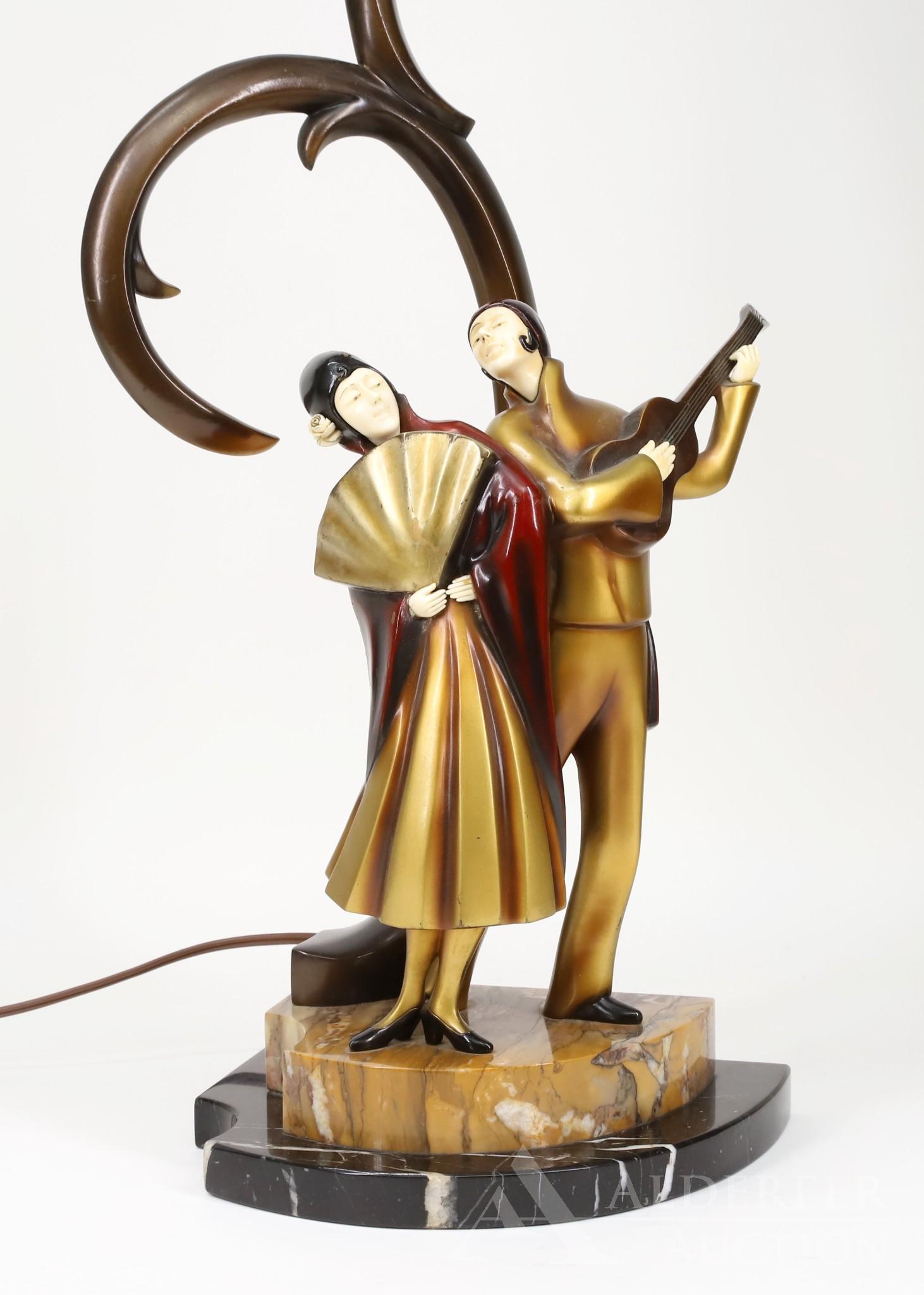 Roland Paris Art Deco Bronze Lamp: Circa 1925, this Art Deco lamp is signed by Roland Paris on the marble base set upon a double marble plinth and features a minstrel mid-serenade. The Austro-German artist, Roland Paris (1894 - 1945)