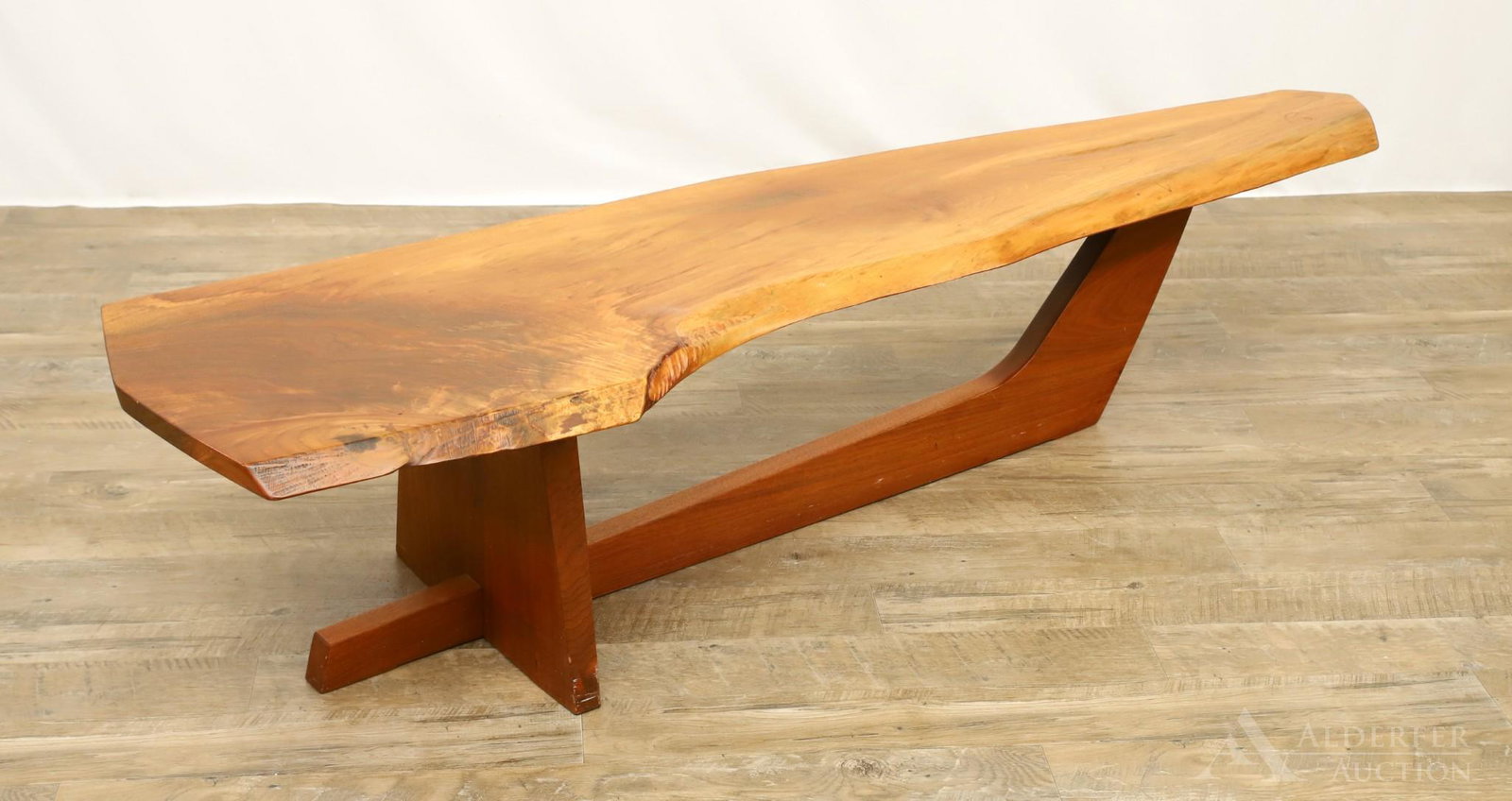 George Nakashima Black Walnut Slab Coffee Table: Free form edge single plank top with a sled base. Signed and dated on underside "George Nakashima Dec. 5 1989" with original drawings of the table from Nakashima Studios dated May 6, 1989. 14"h x 65