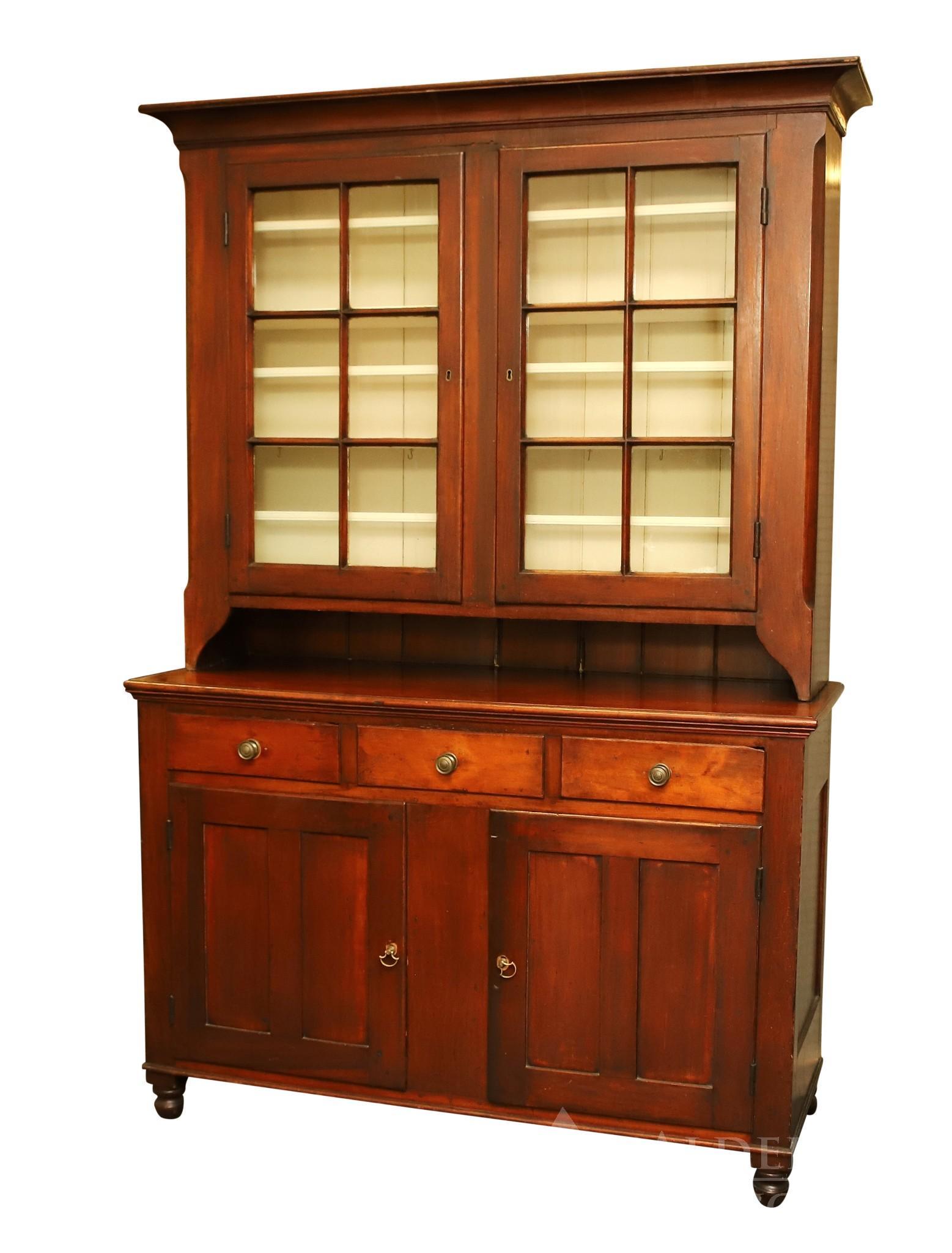Pennsylvania Dutch Cupboard: Mixed wood. Molded cornice, two six lite glazed door top with a 6 pie shelf over three drawers over two doors on turned feet. 85"h x 58"w x 20.5"d