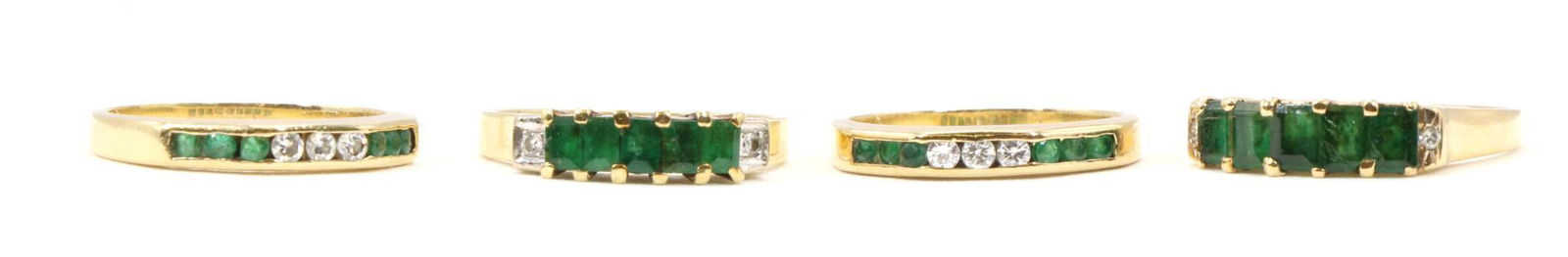 14KY Gold Emerald and Diamond Stackable Rings: Channel settings feature (3) round diamonds flanked by (6) round emeralds, 2.8mm wide, sizes: 4.5 , 4.75. Filigree settings, similar but not identical, feature (5) emerald cut emeralds flanked by (2)