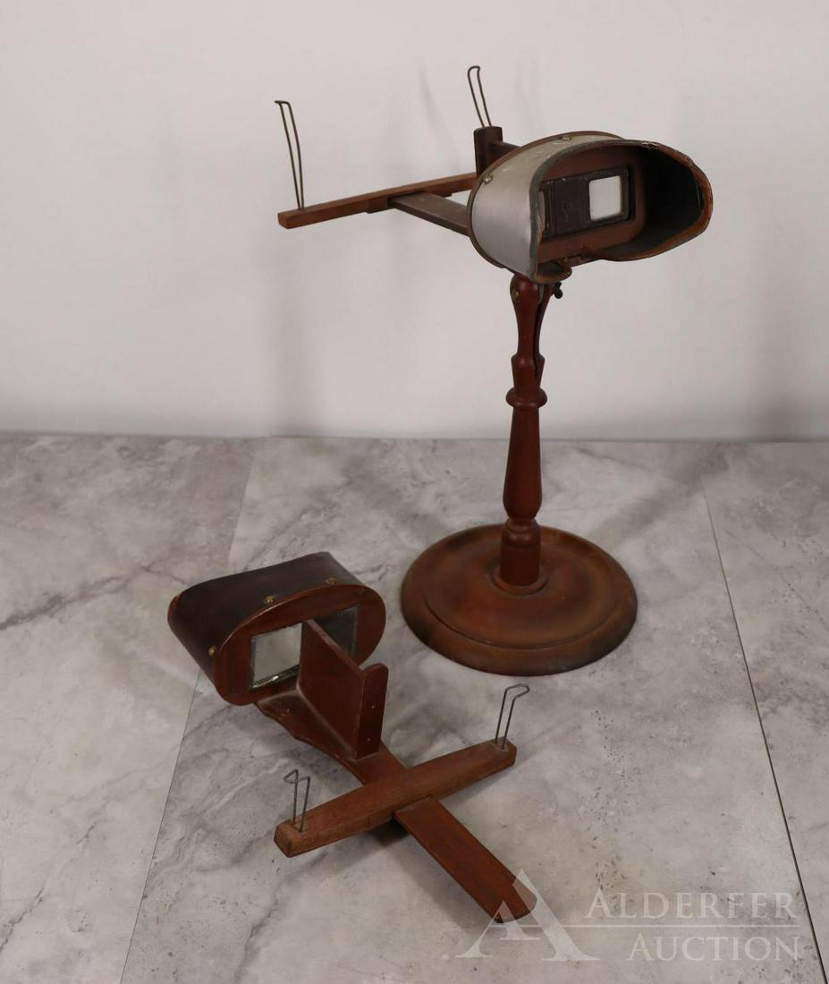 Stereoscopes: Wooden and etched metal stereoscope with stand, and a wooden stereoscope. Standing scope measures 14.75"h