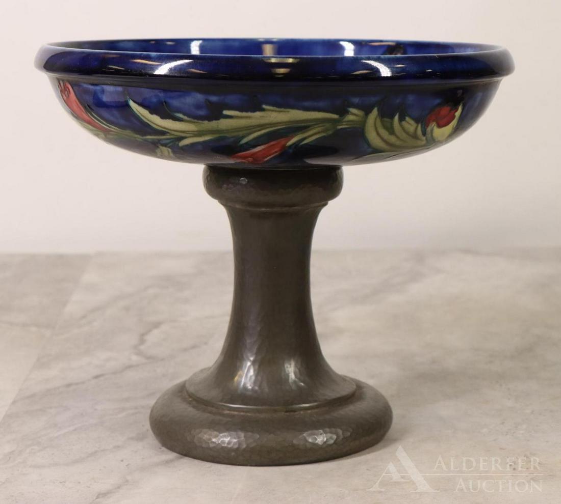 Moorcroft Pottery, Tudric Compote For Liberty & Co.: Moorcroft pottery and Tudric pewter compote, c.1920. Hammered pewter base, marked "Made in England, "Tudric" 01312" on bottom. Desogned by William Moorcraft for Liberty and Company. 8"h x 9.5"round