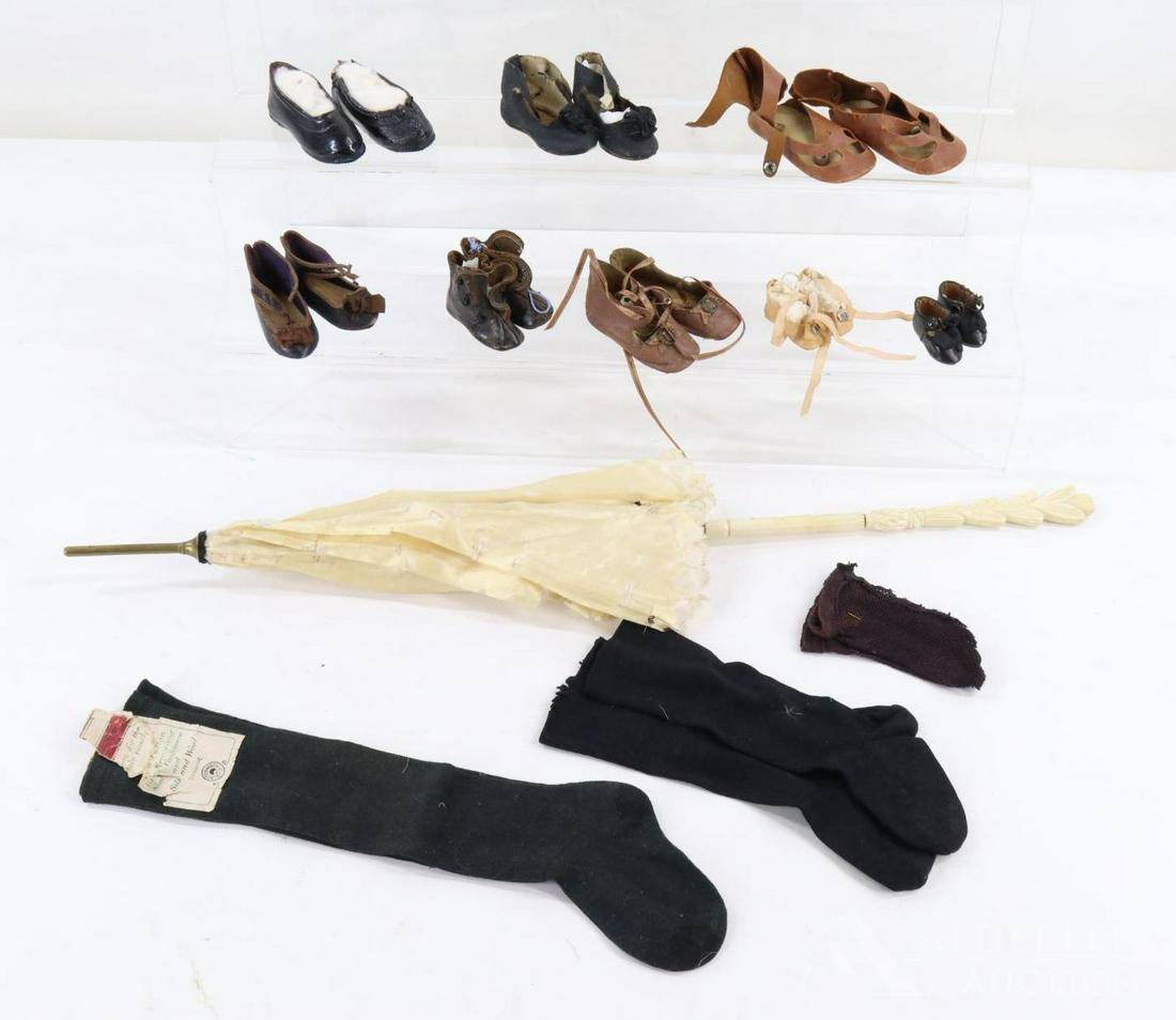 LOT OF ANTIQUE/VINTAGE ACCESSORIES.: Lot of antique accessories. Ladies' or child's ivory silk parasol with bone handle. (3) Prs. of black socks -3 1/2", 8", 12 1/2". Doll shoes - (1) pr. rubbers, Keystone No. 2 leather boots, "7" PARIS 