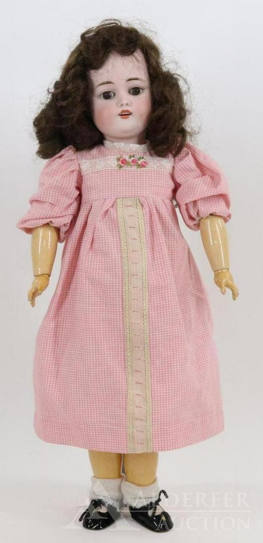 GERMAN BISQUE HEAD DOLL.: 22" MADE IN GERMANY E.168.9 doll with brown sleep eyes, open mouth, brown synthetic wig. Papier mache ball jointed body. Dressed in vintage clothing, newer shoes, socks. Condition: nothing observed on