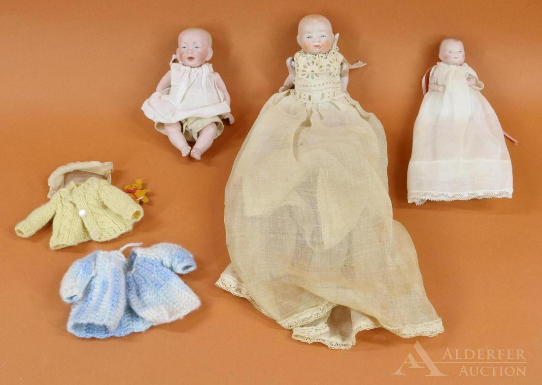 LOT OF ALL BISQUE DOLLS.: Lot of (3) baby dolls with solid domes, painted blue eyes, closed mouths, painted hair, 5 pc. bent limb baby bodies. They are all wearing antique white cotton clothing. 4" 20-10 COPR BY GRACE S. PUTNA
