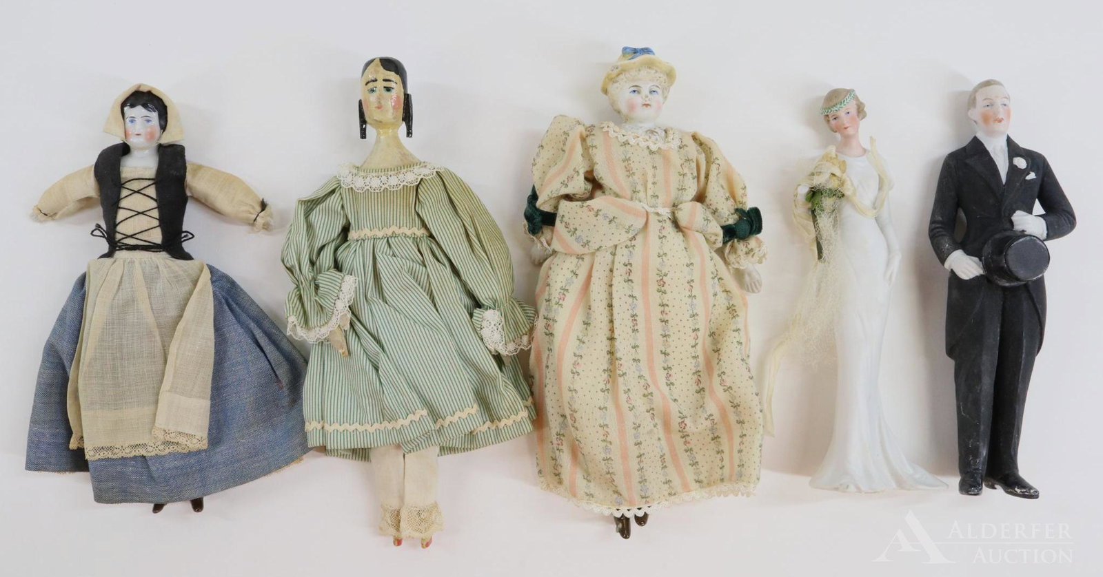 LOT OF CHINA/BISQUE/PARIAN/WOOD DOLLS.: Lot of (5) dolls. China - 7 1/2" Low brow with black hair. All original clothing. Wood - 8 1/2" (Peg wooden style) doll with carved side curls, painted features. All wood jointed body. Vintage cotton 