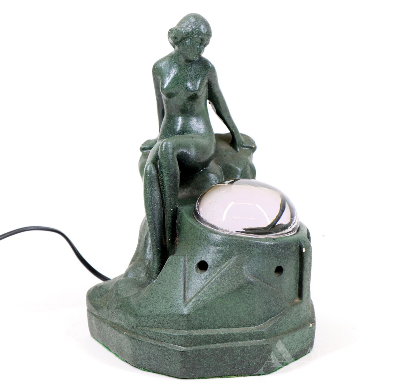 Desk Lamp In the Manner of Frankart: Desk lamp of a lounging female nude. Bulb under a glass dome, currently in working condition. Composite base. Chipped. 10"h x 7.5"w x 6.5"d **Please Note: This item is NOT eligible for in-house shippi