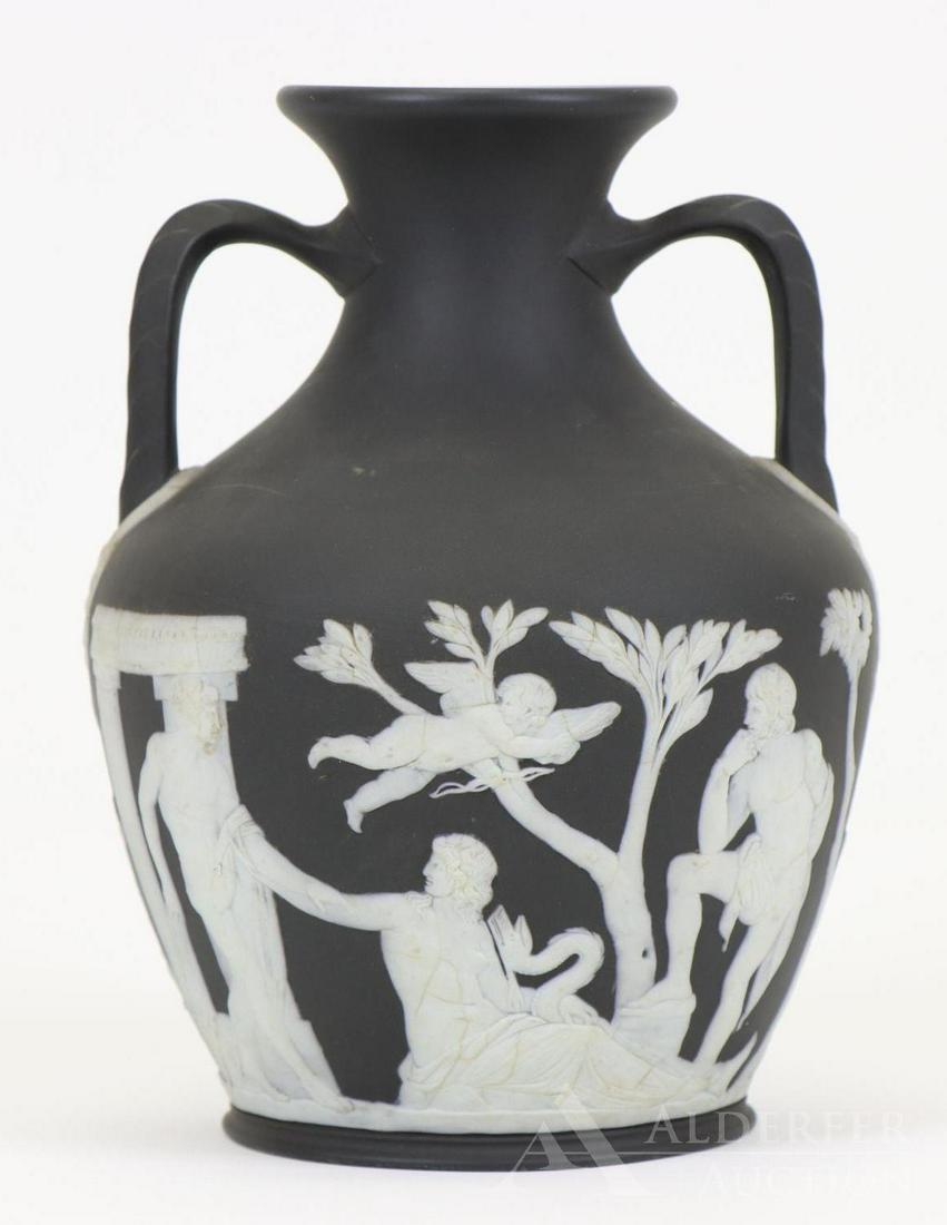 Wedgwood Portland Vase: Black basalt jasper solid "Portland Vase", with impressed upper case mark. Crazing to the relief decoration and other surface wear. 8"h x 5.5"w **Please Note: This item is NOT eligible for in-house sh