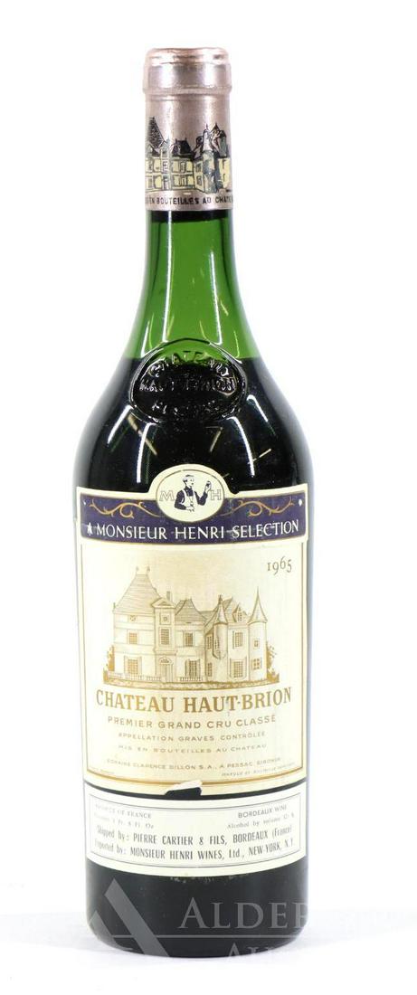 Chateau Haut-Brion Premier Grand Cru Classe Wine 1965: Chateau Haut-Brion Premier Grand Cru Classe 1965. (1) bottle of wine at 750 ml. Fill down 4 cm, slight tear on label. This item is not available for shipping, pick up only.