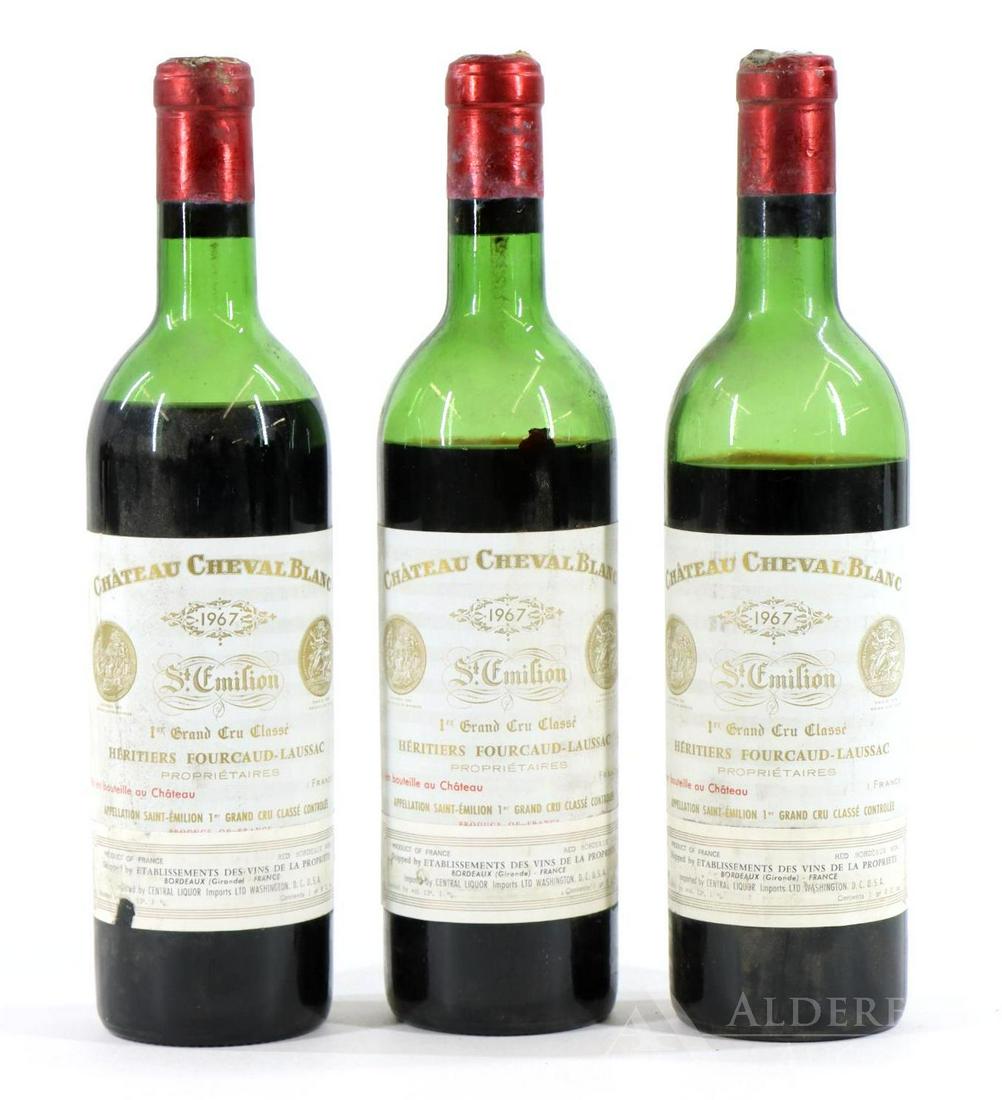 Chateau Cheval Blanc 1er Grand Cru Classe Heritiers: Chateau Cheval Blanc 1er Grand Cru Classe Heritiers Fourcaud-Laussac St. Emilion, 1967. (3) bottles of wine at 750 ml. Low shoulder fill (2) and mid shoulder fill (1); molded capsule; one label nicked